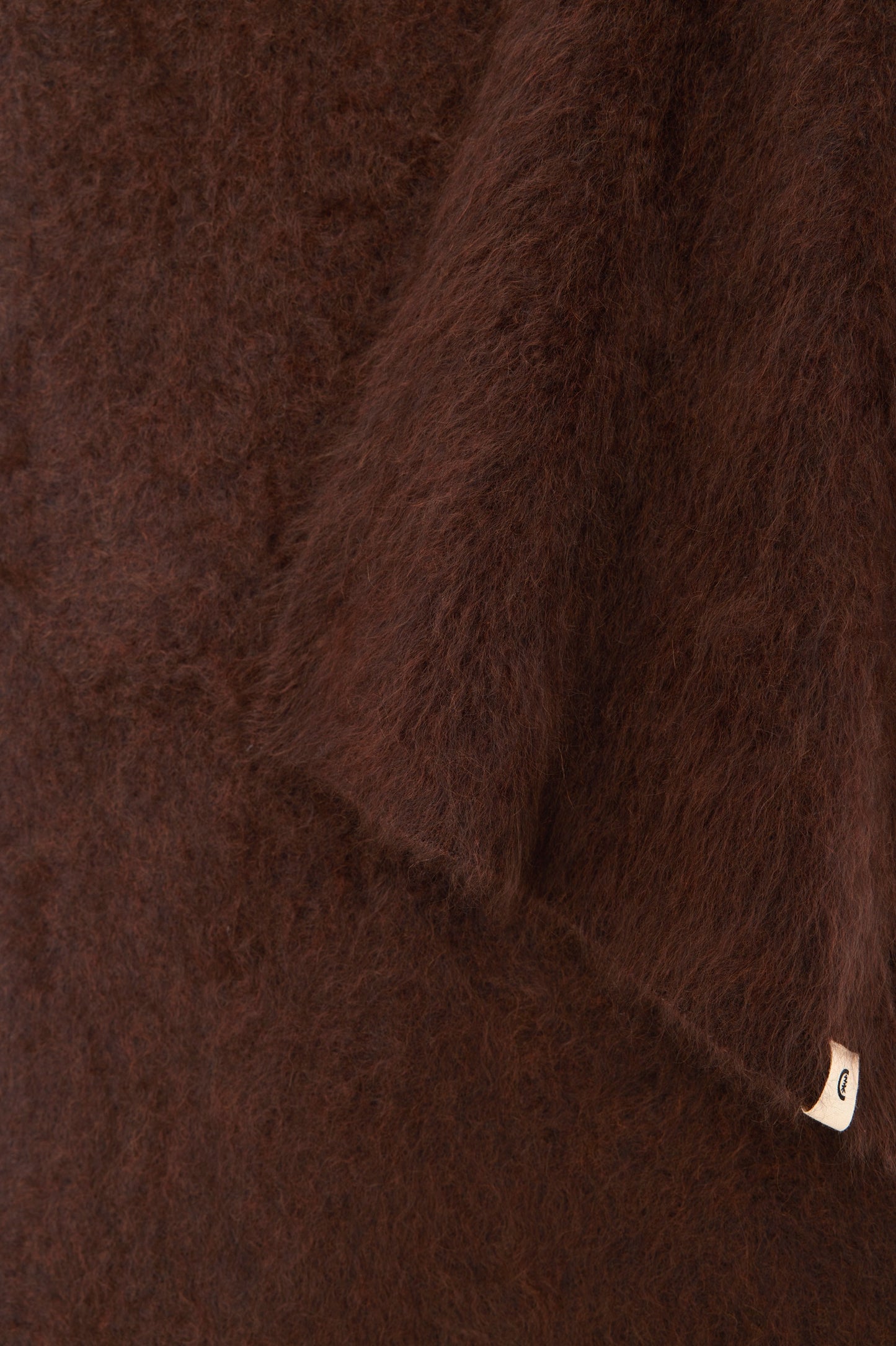 Close-up detail revealing the plush, soft fibres and natural matte finish.