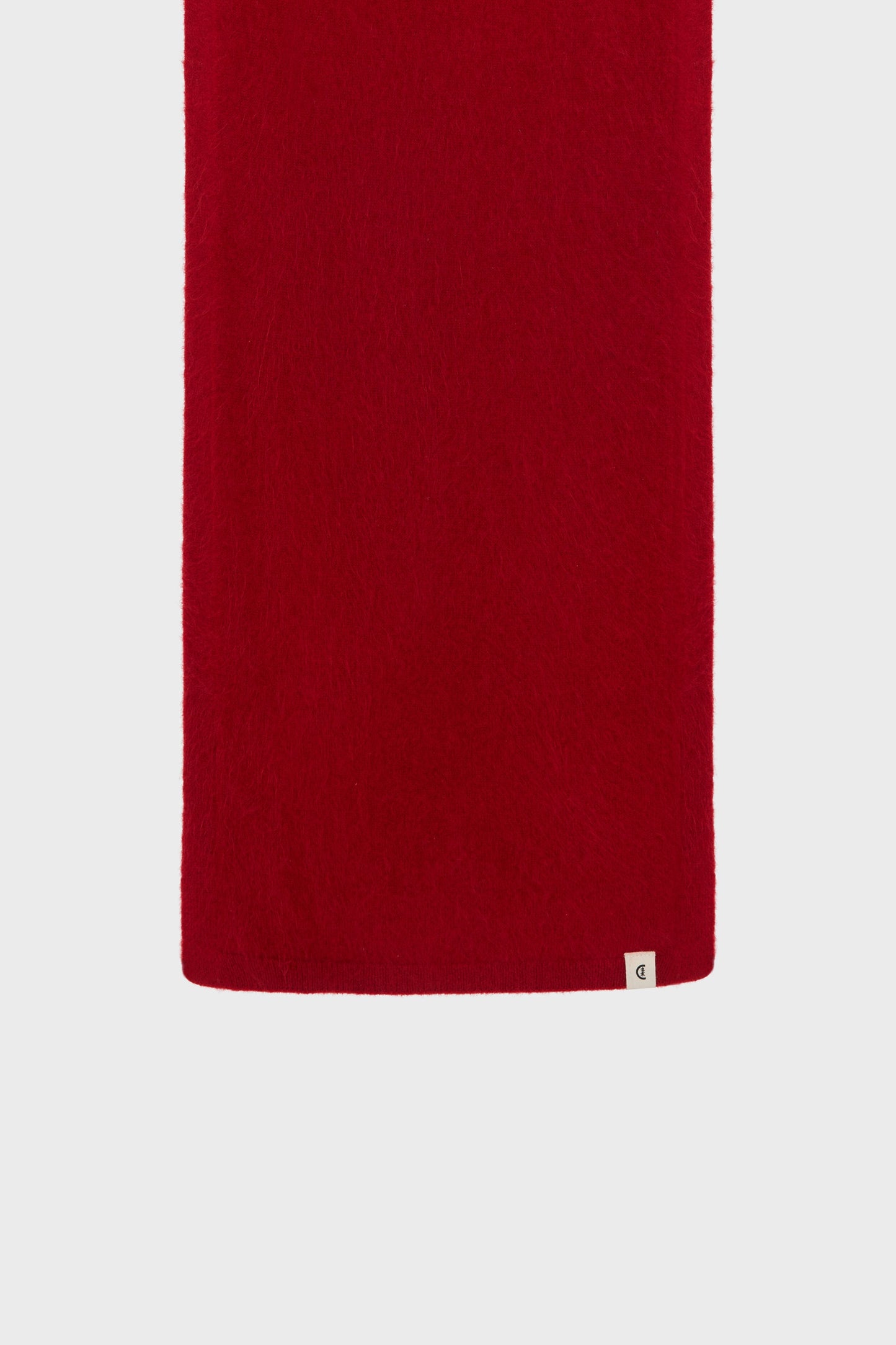 Folded detail revealing the soft, dense texture of the fine cashmere knit.