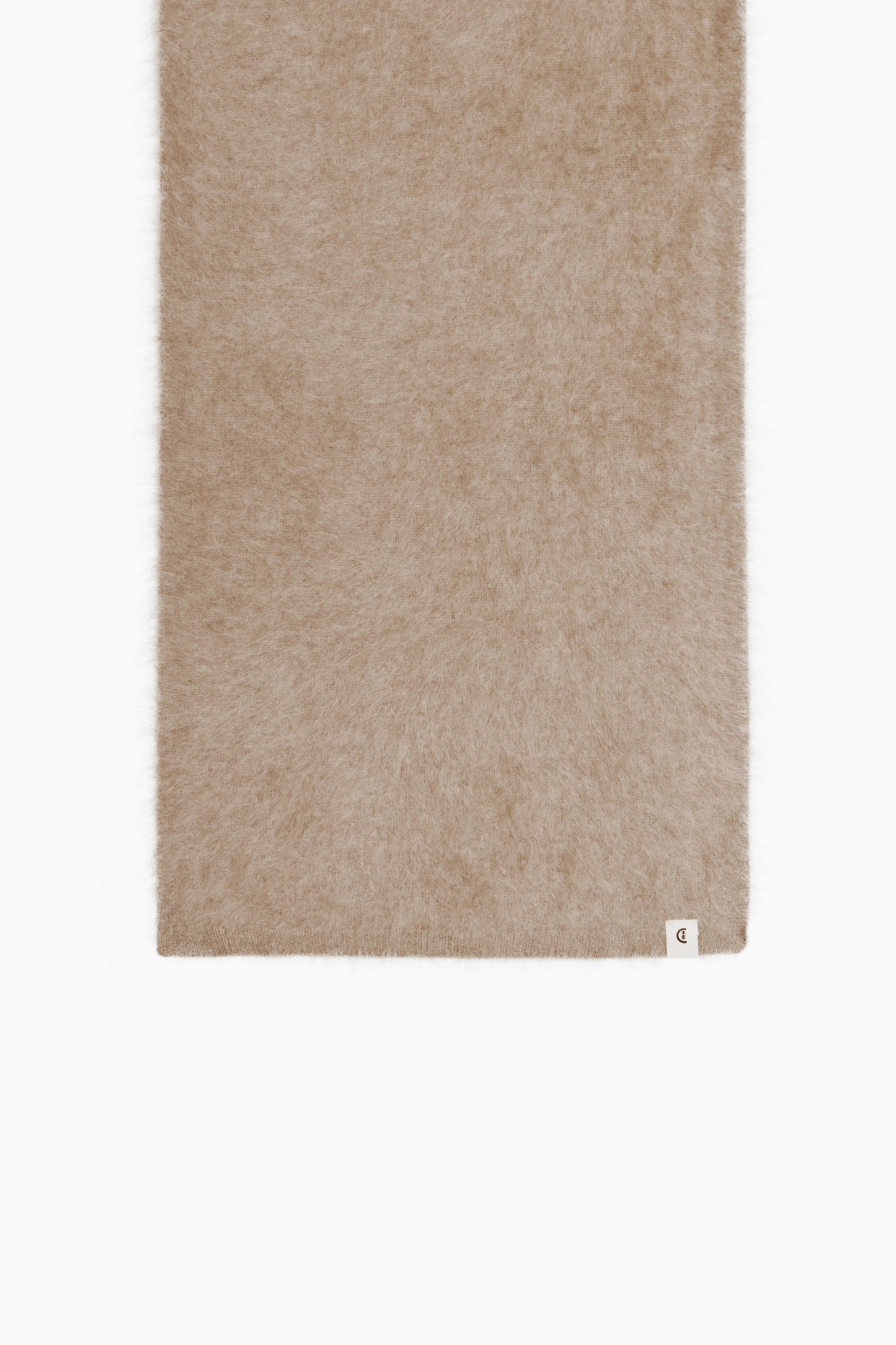 Folded view revealing the scarf’s soft brushed texture and subtle weave.