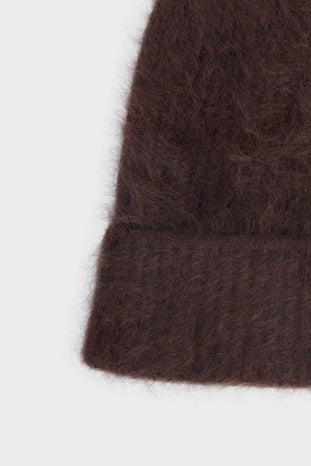 Close-up of the front fold, focusing on the plush cashmere fibres and the small contrasting logo label.
