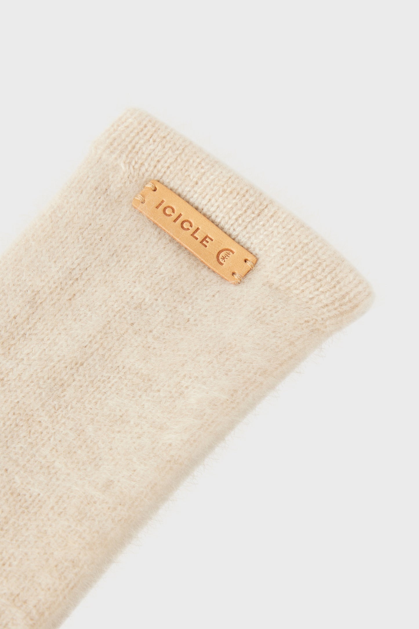 Detail shot showing the ribbed cuff and contrasting logo label.