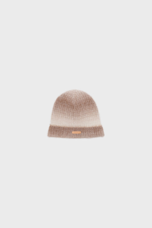 Front view of a cashmere beanie with a soft gradient pattern in camel and light beige, displayed on a neutral background.