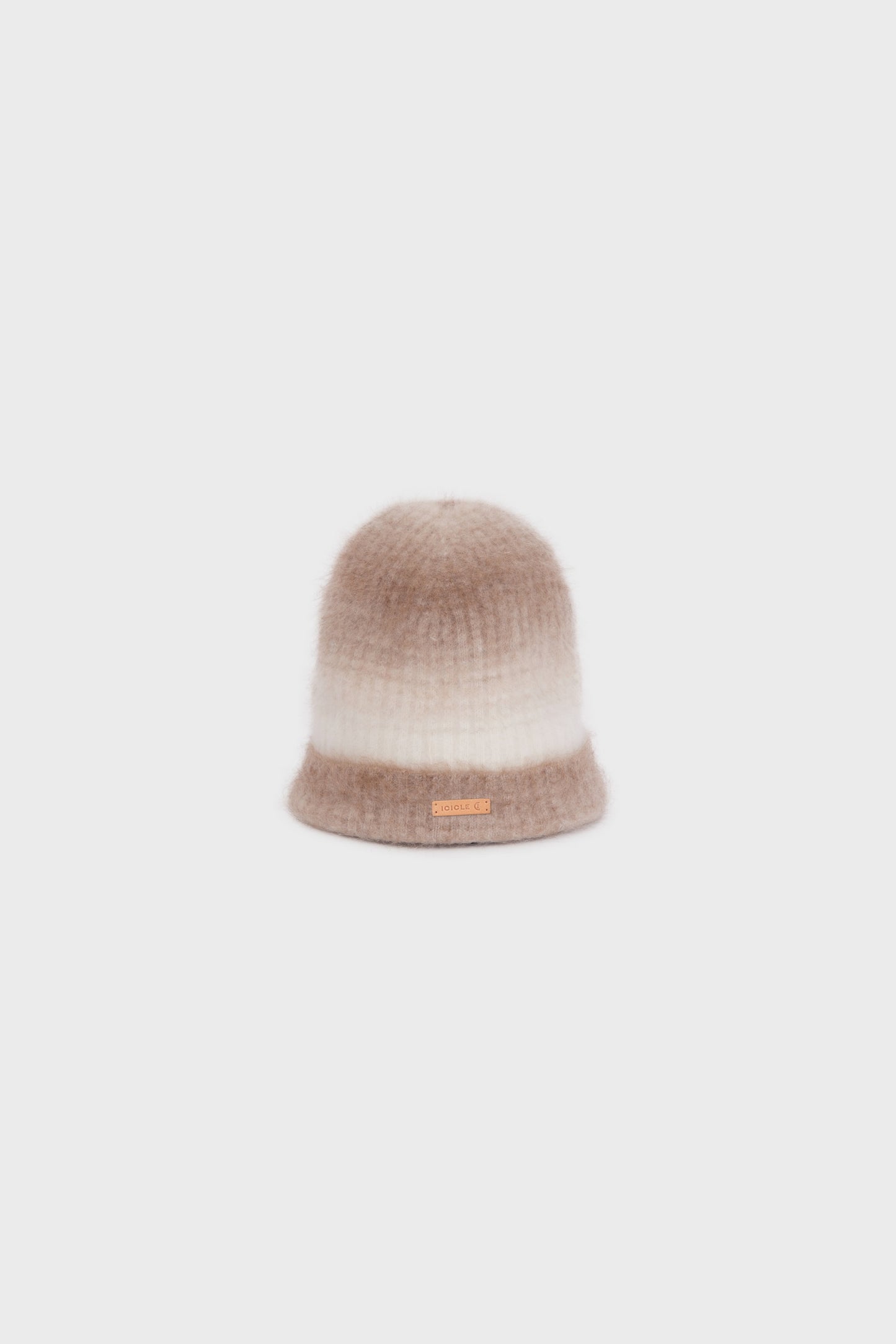 Angled view of the cashmere beanie highlighting its ombré effect and ribbed texture.