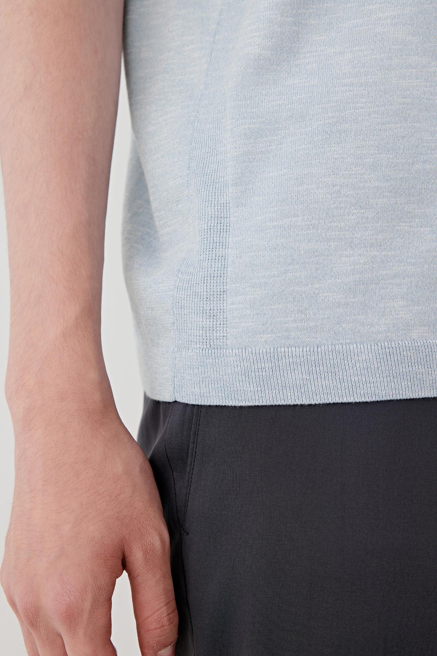 Close-up of the lower body area highlighting the lightly textured slub knit surface, fluid hand and natural variation created by the cotton and silk yarn blend. The image reveals the fabric's subtle depth and lightweight character.