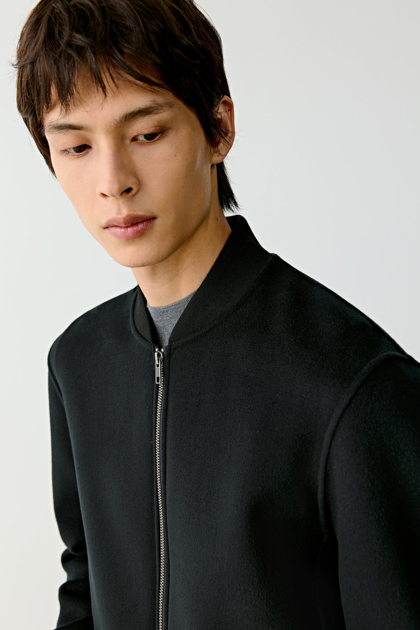 Side angle showing the relaxed fit and clean zip line.