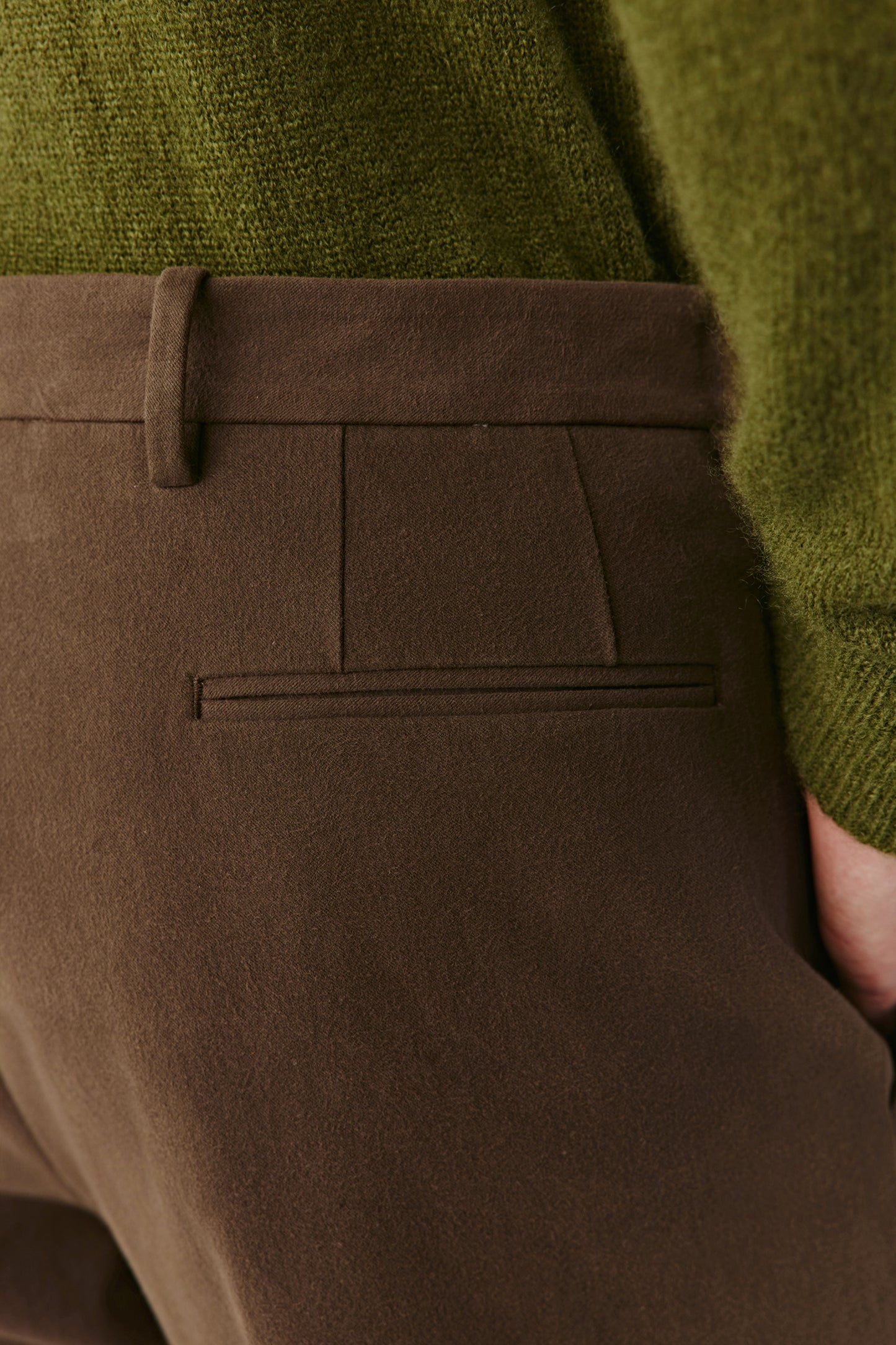 Close-up of the waistband and pocket detail, showing the texture of the stretch cotton twill and fine stitching.