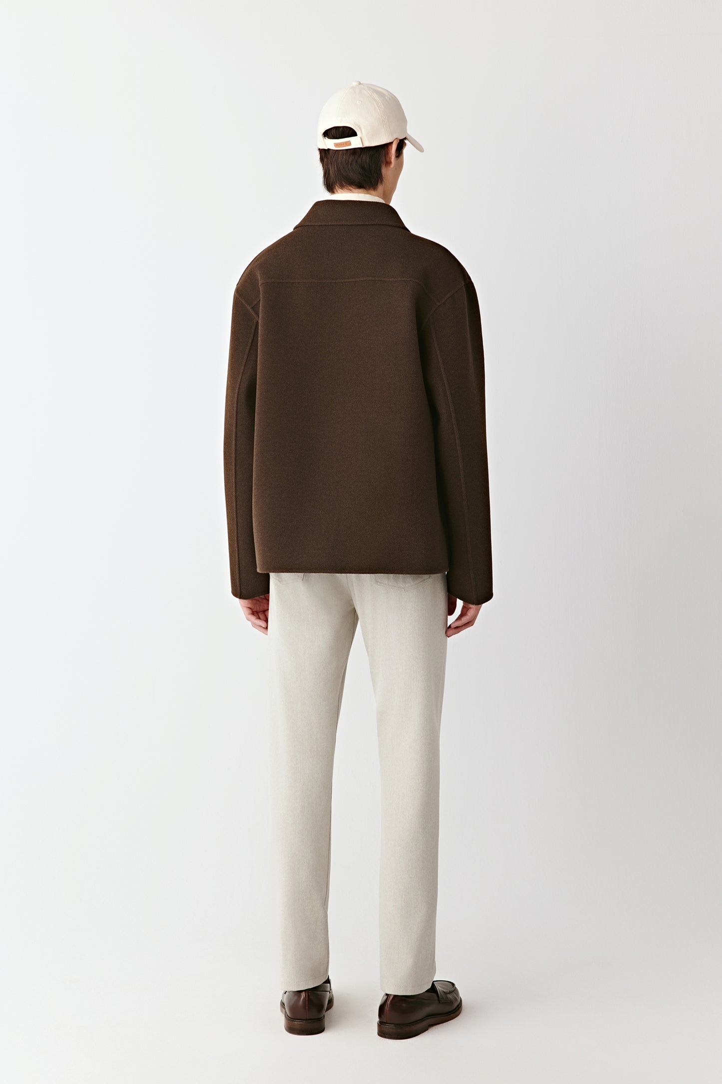 Detail shot of the yak wool twill fabric and pocket seam, showcasing the refined texture and craftsmanship.