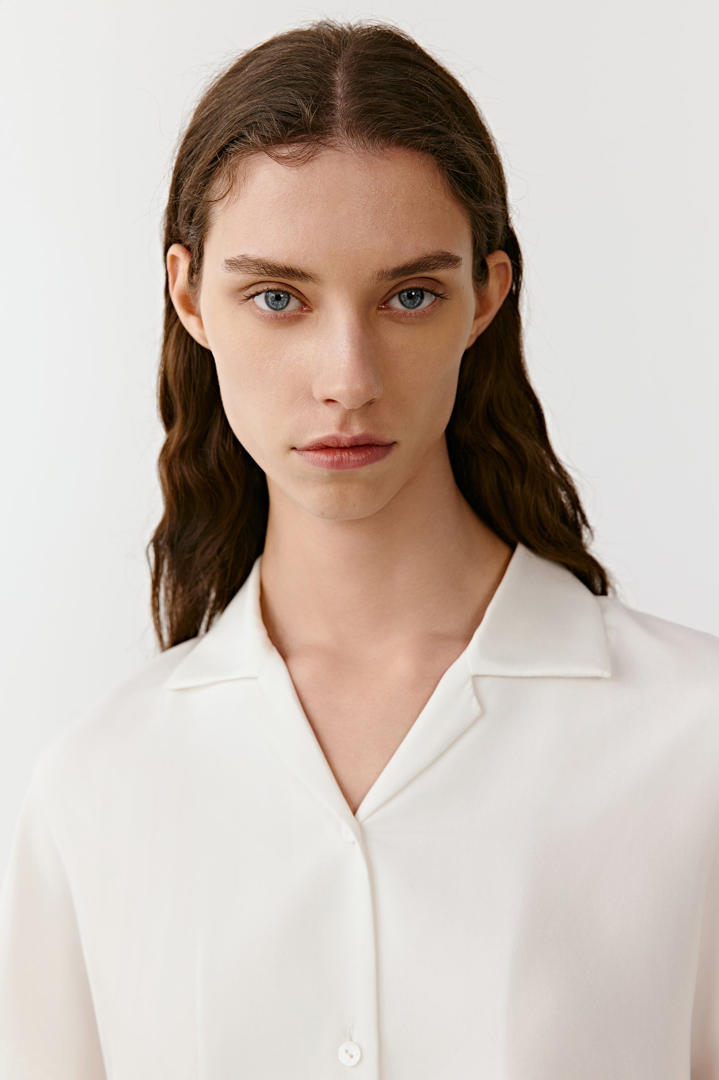 A portrait shows the soft texture of silk and the subtle glow of the ivory tone.