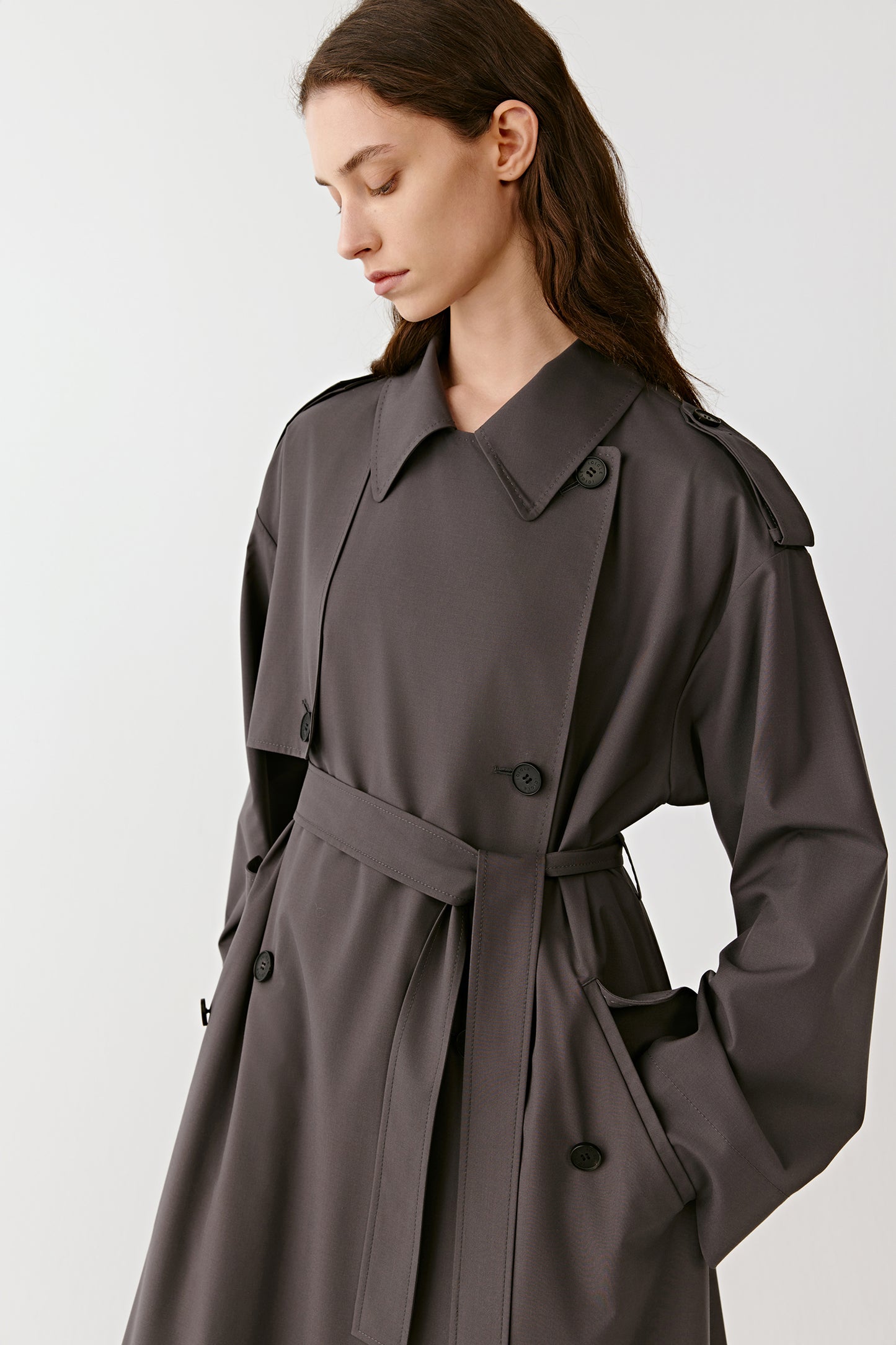 A three-quarter view reveals the structured shoulders and light drape of the material.