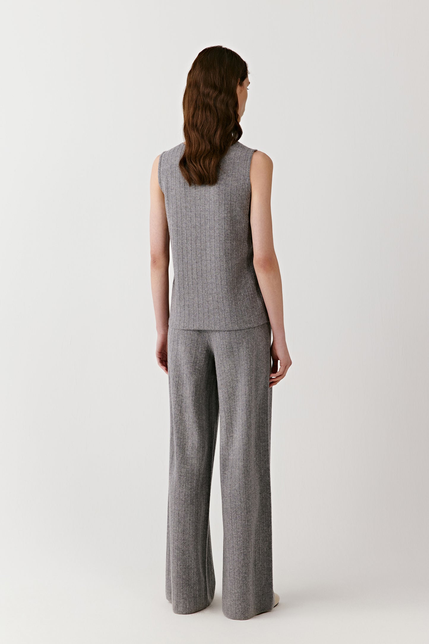 Back view highlighting the straight cut and fine ribbed texture of the sleeveless top.