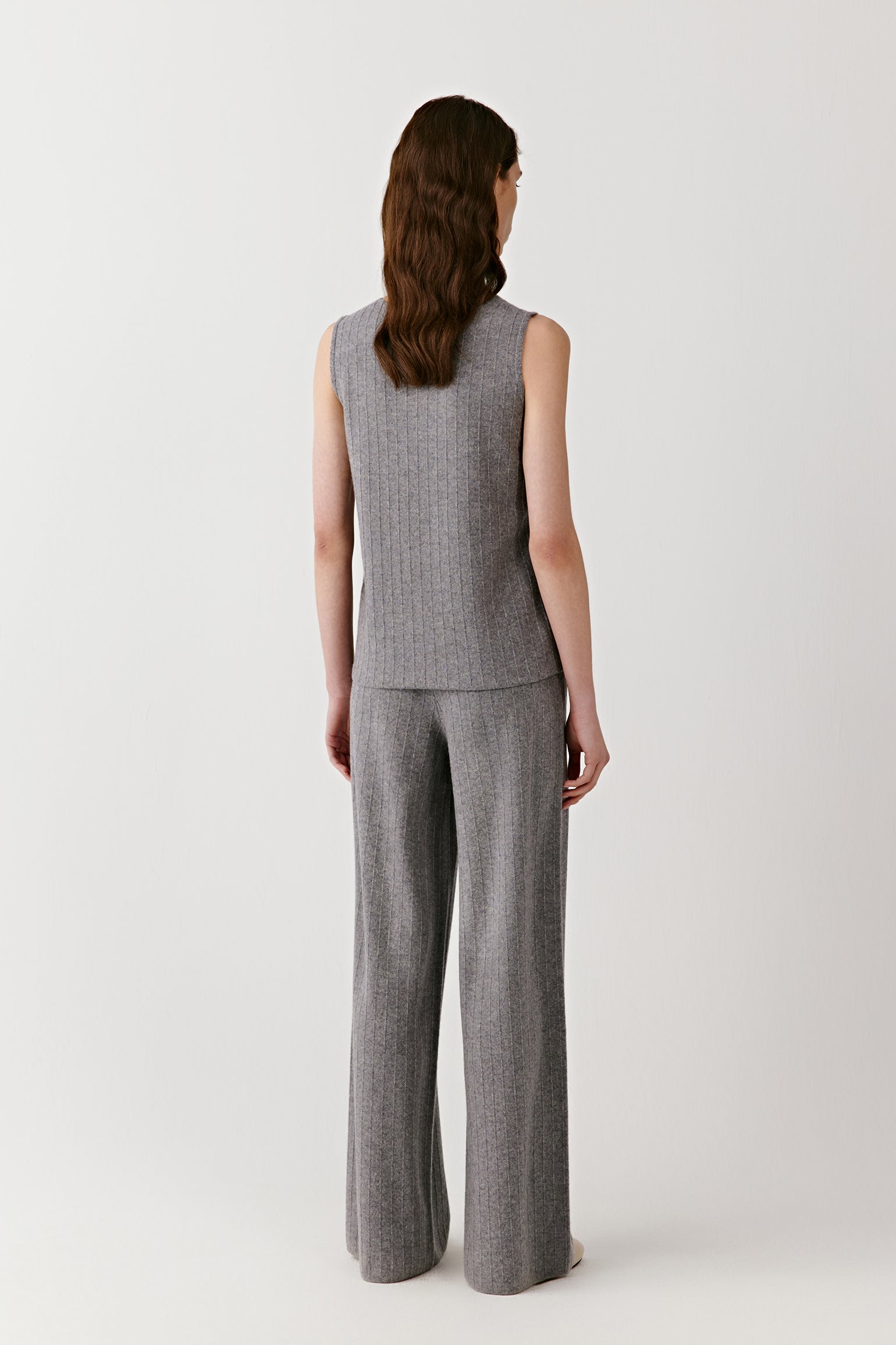 Back view highlighting the straight cut and fine ribbed texture of the sleeveless top.