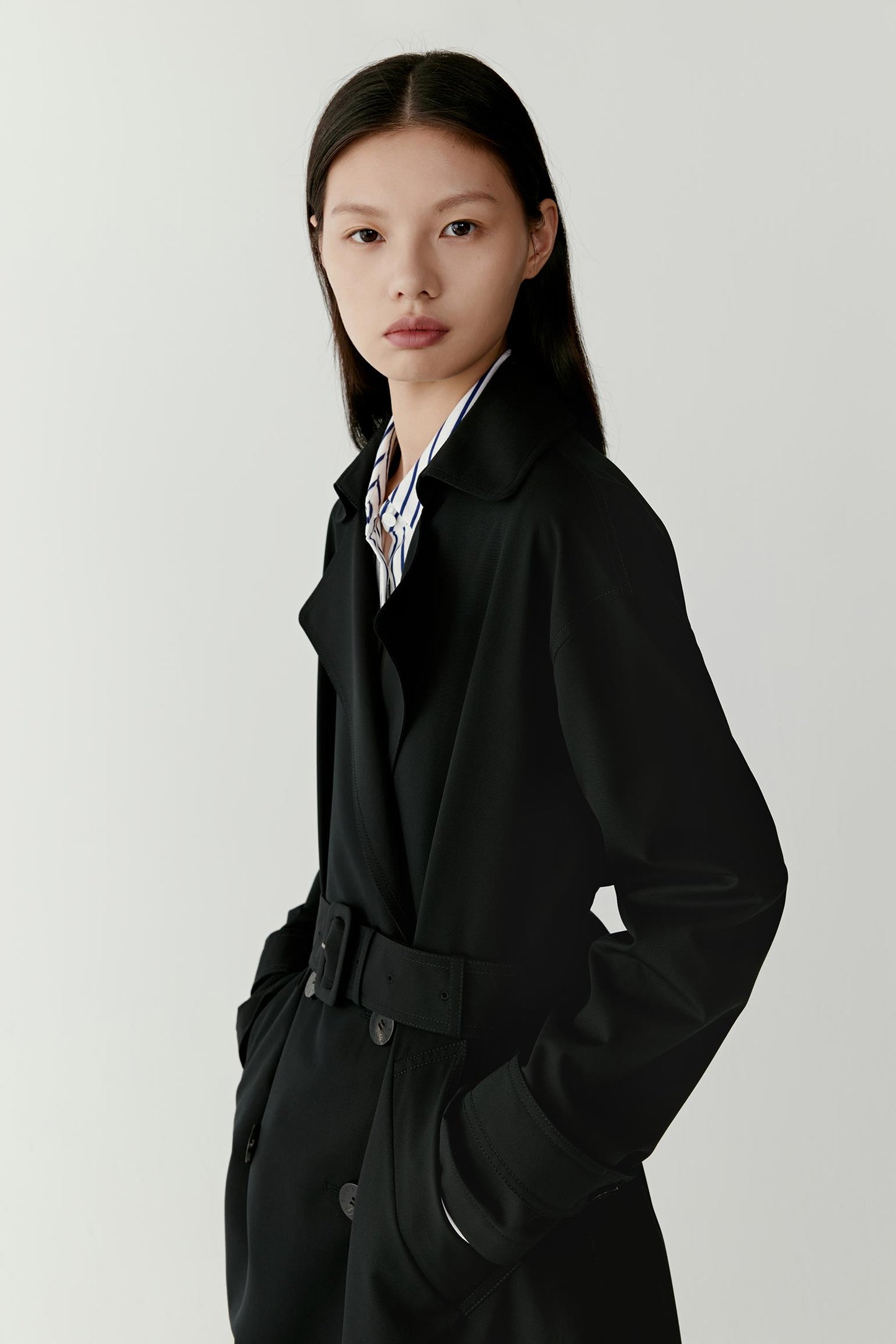 Close-up images focus on the matte texture, collar, and buttons.