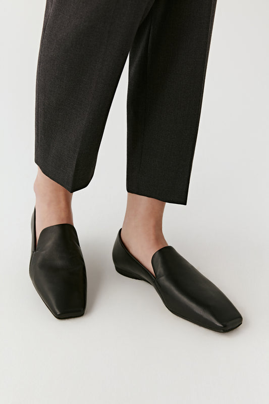 Side view focusing on the clean lines and smooth leather surface.