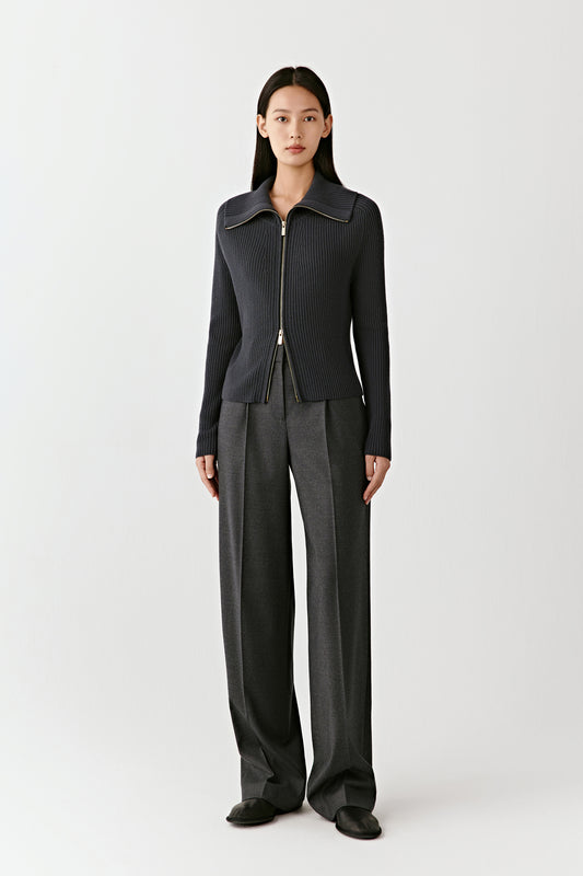 Full-length view of the ribbed wool zip cardigan, showing the slim fit and structured drape.