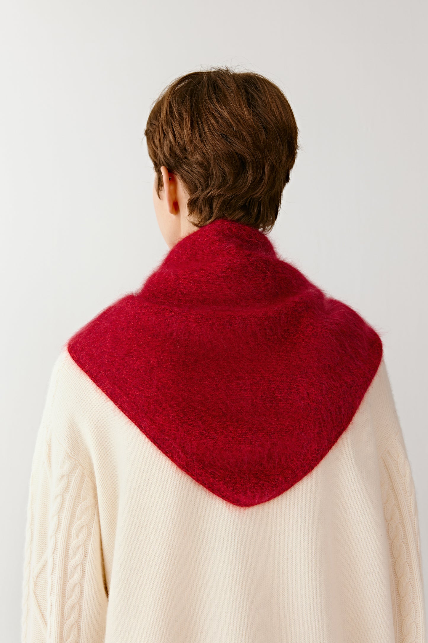 Rear view showing the drape and vivid tone of the red cashmere yarn.