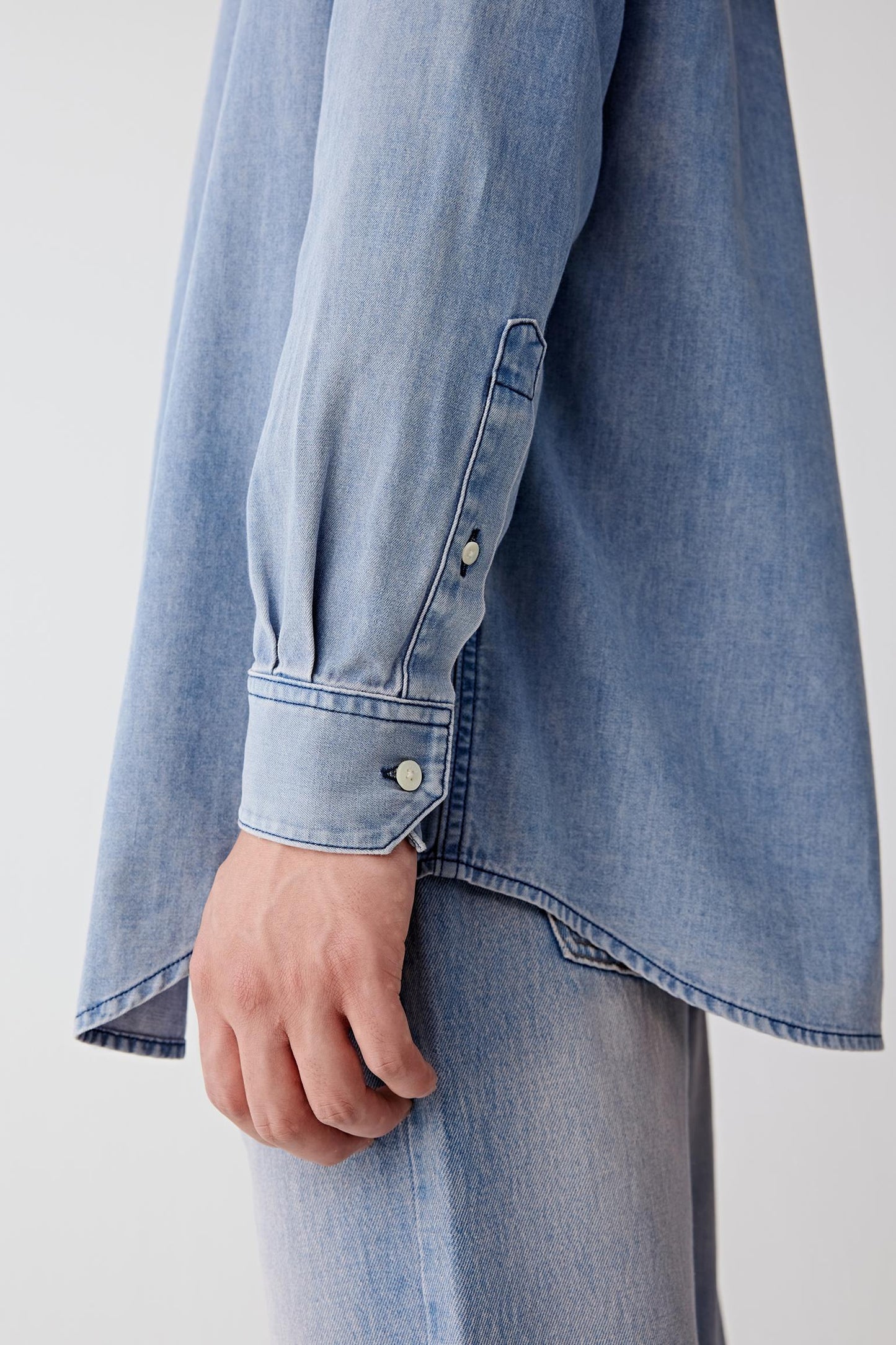 Close-up of the sleeve cuff and stitching detail.