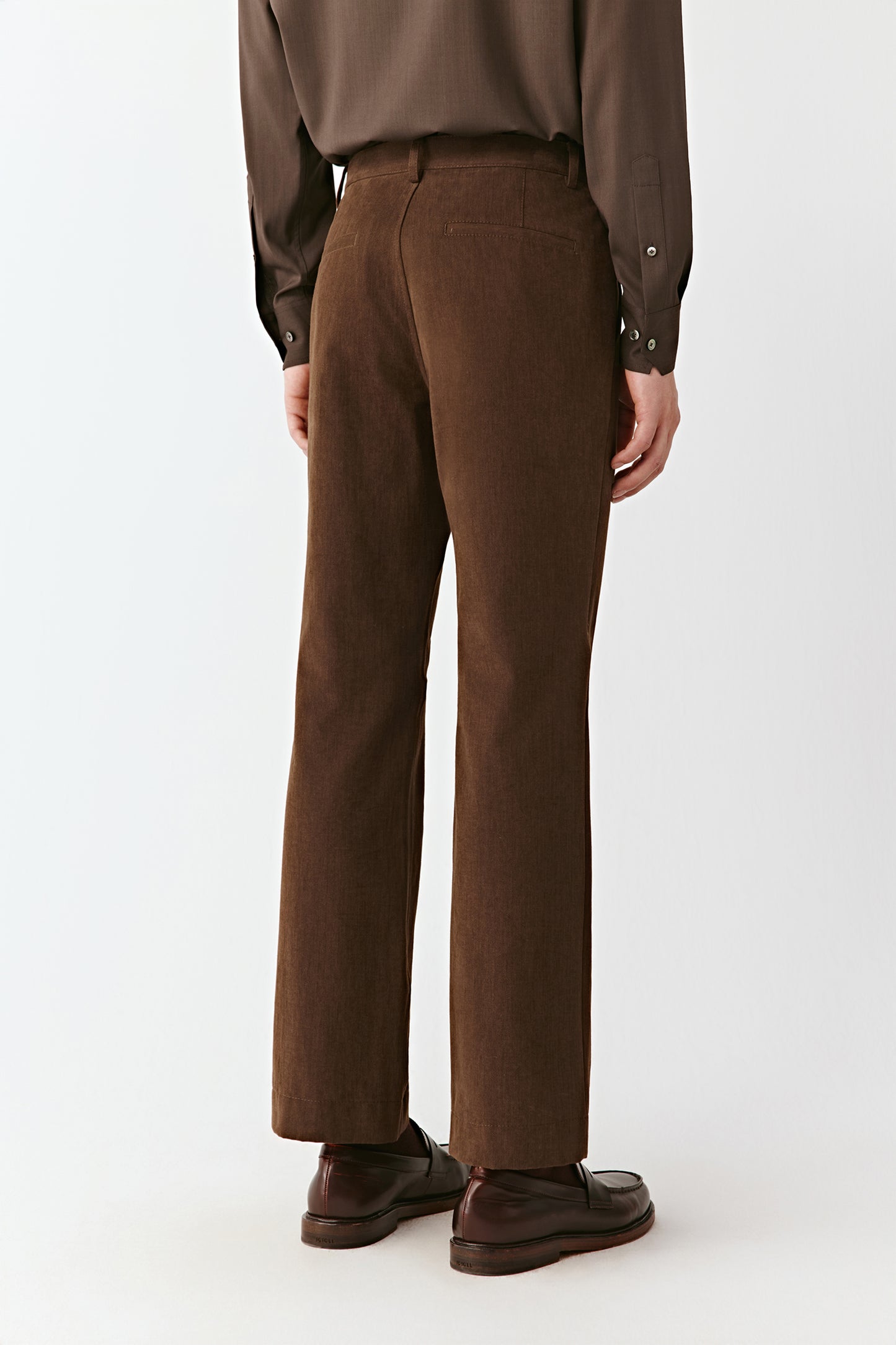 Rear view displaying the fitted waistband and back pockets.