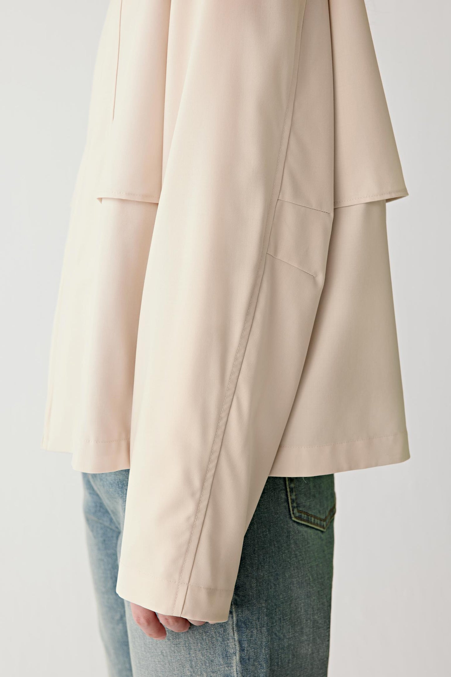 Detail of the hem and soft wool texture.