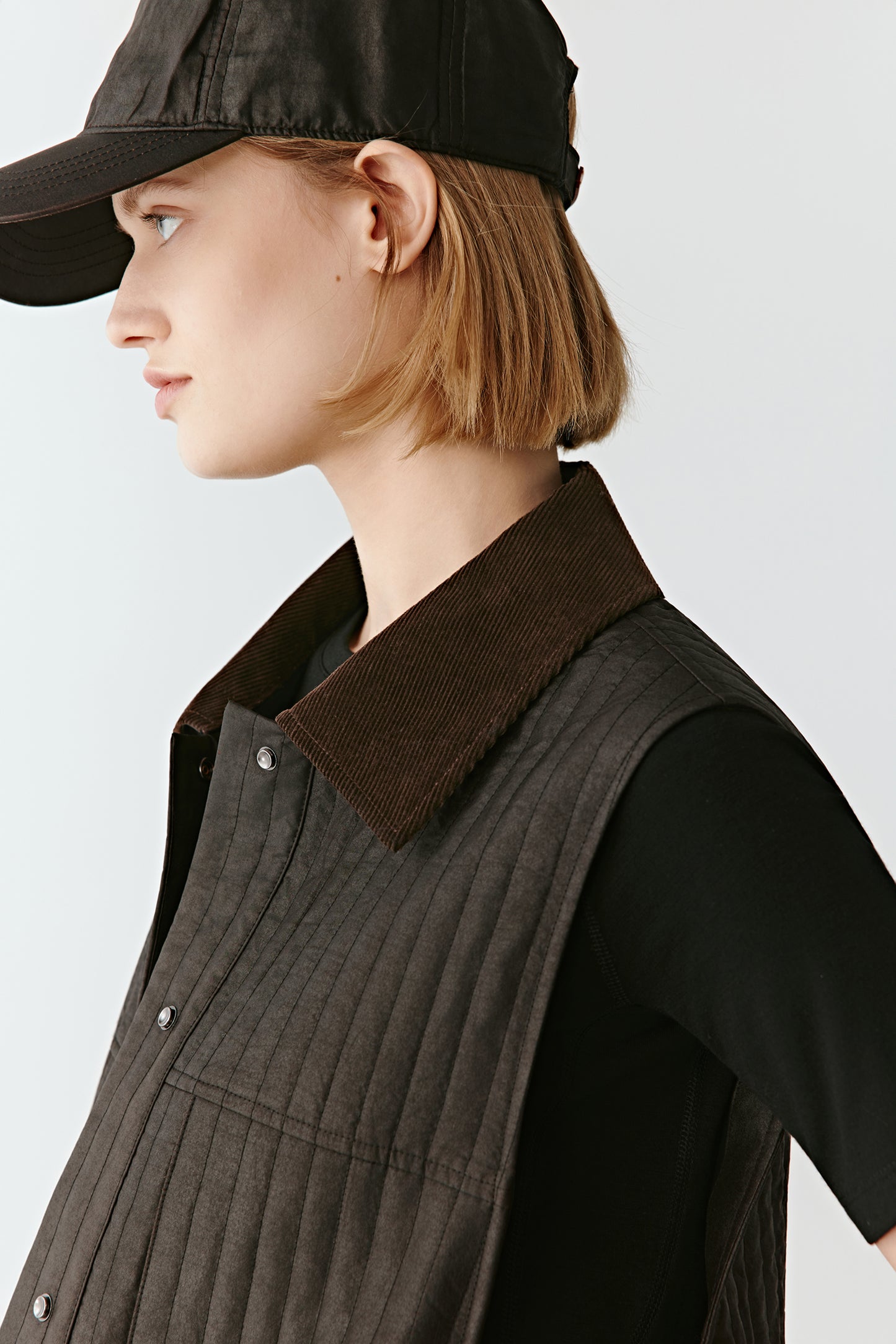 Portrait focusing on the velvet collar contrast and neckline detail.