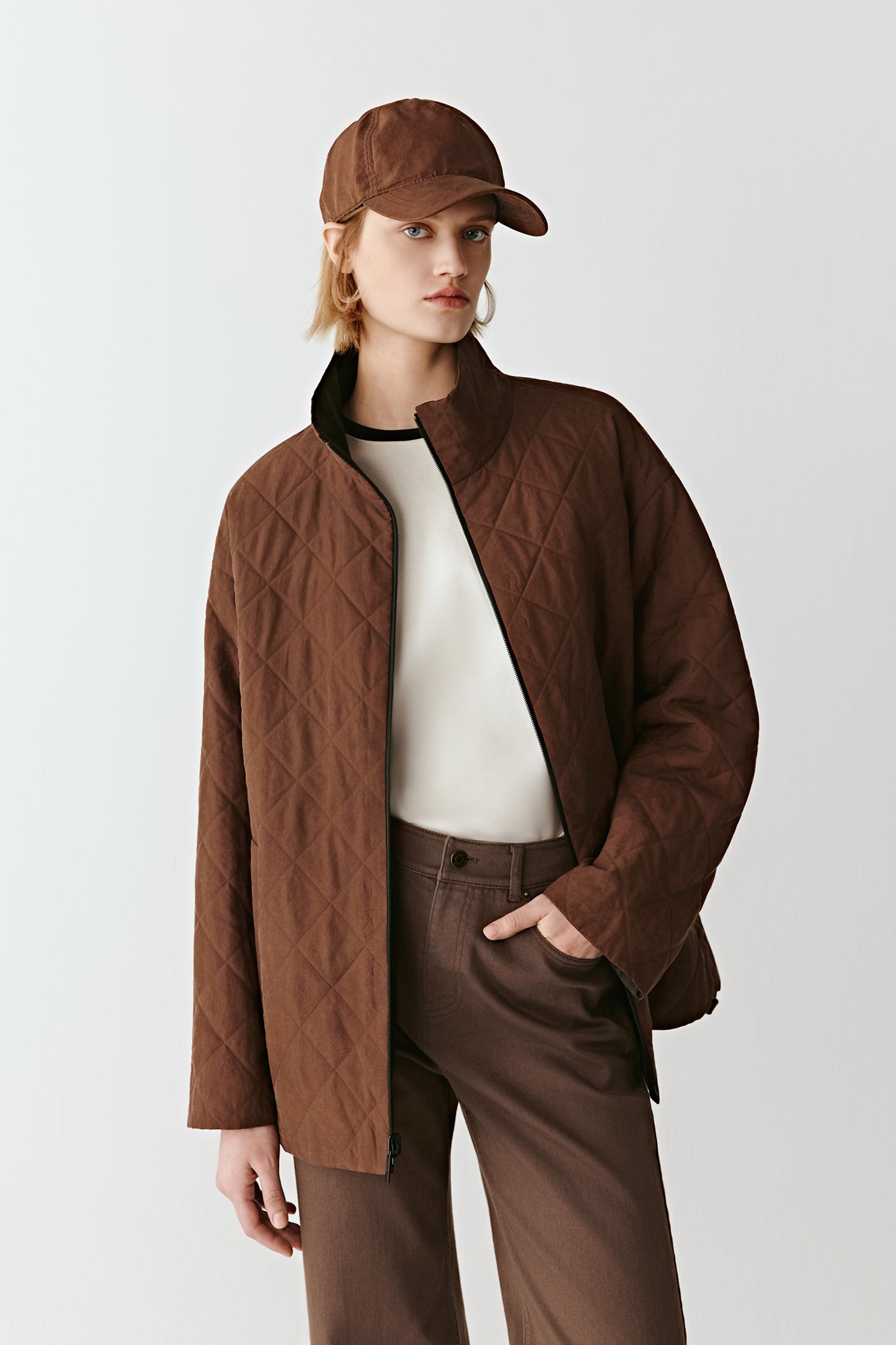 Side angle showing the short, square cut and subtle fabric detail.