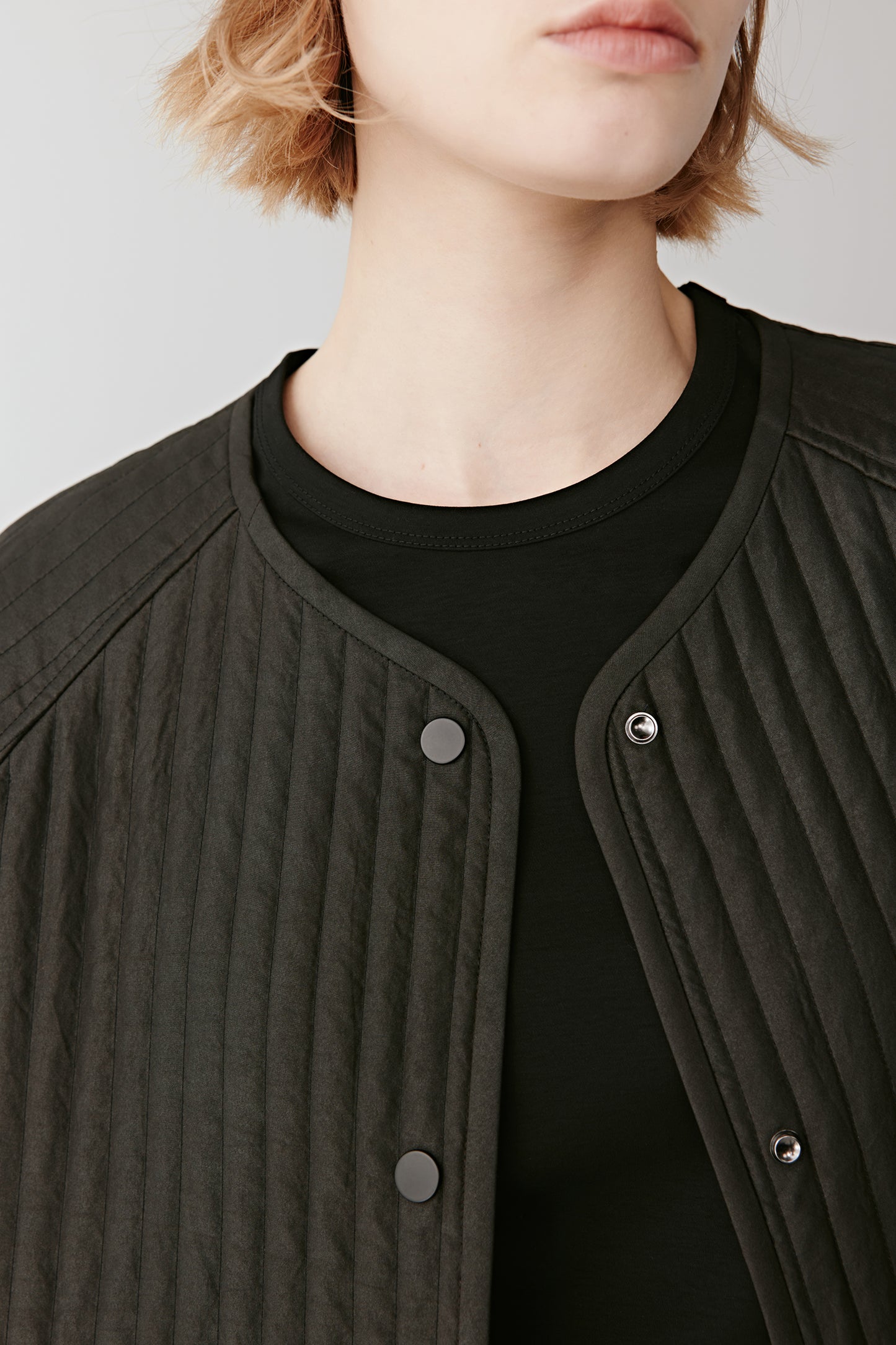 Detail shot of the vertical quilting emphasizing the texture and structure.