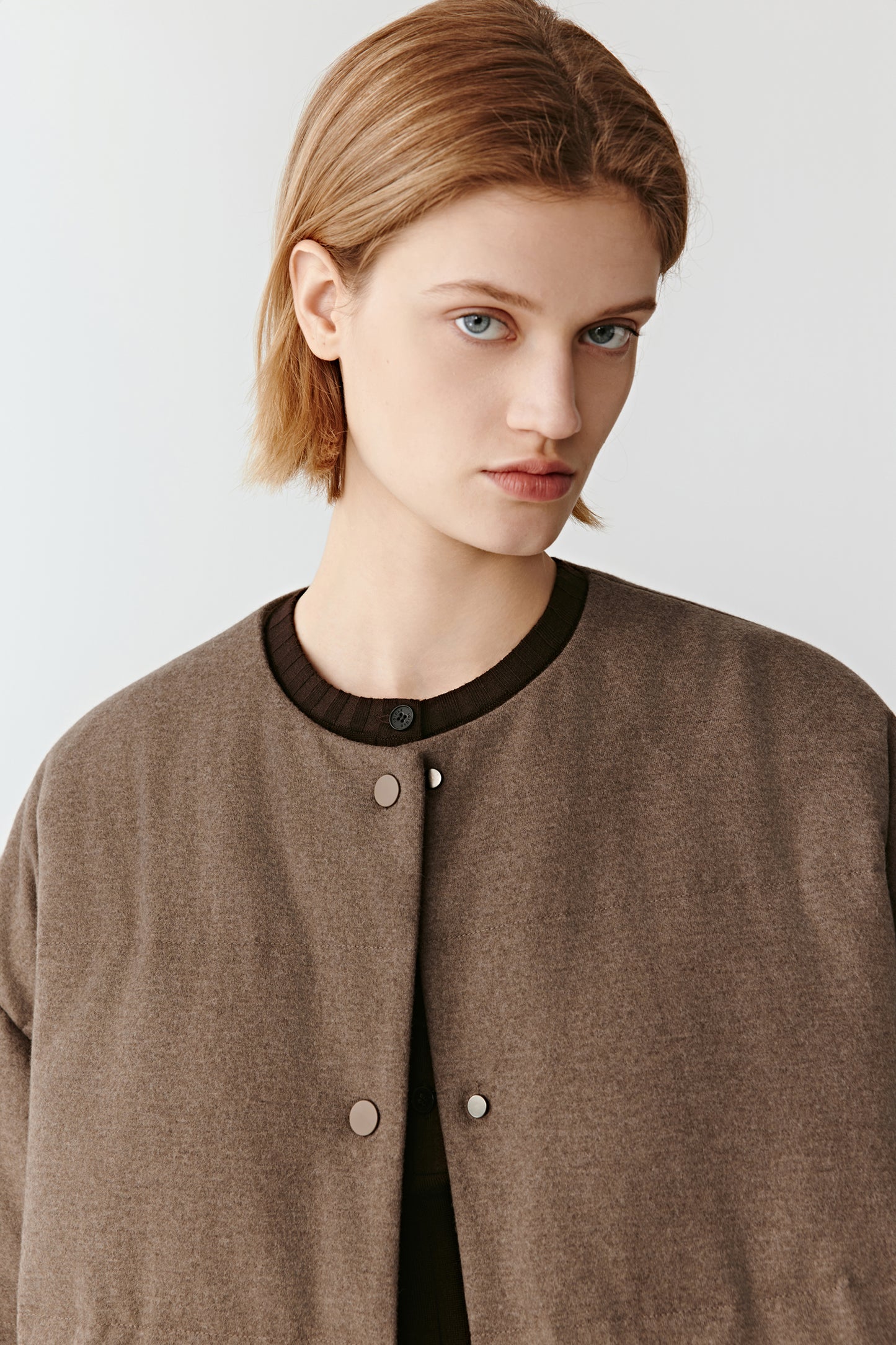 Front focus on the concealed fastening and stand collar construction.