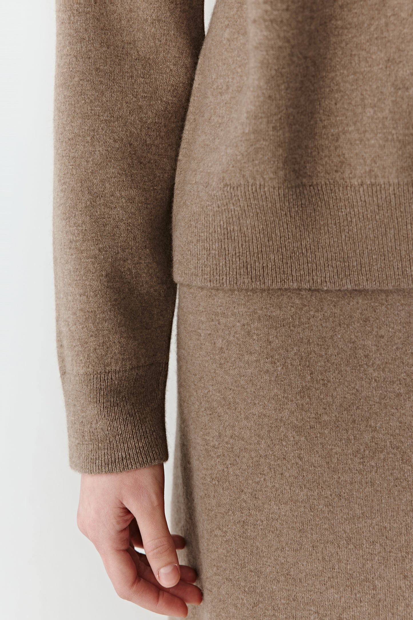 Close-up of sleeve cuff showing ribbed finishes.