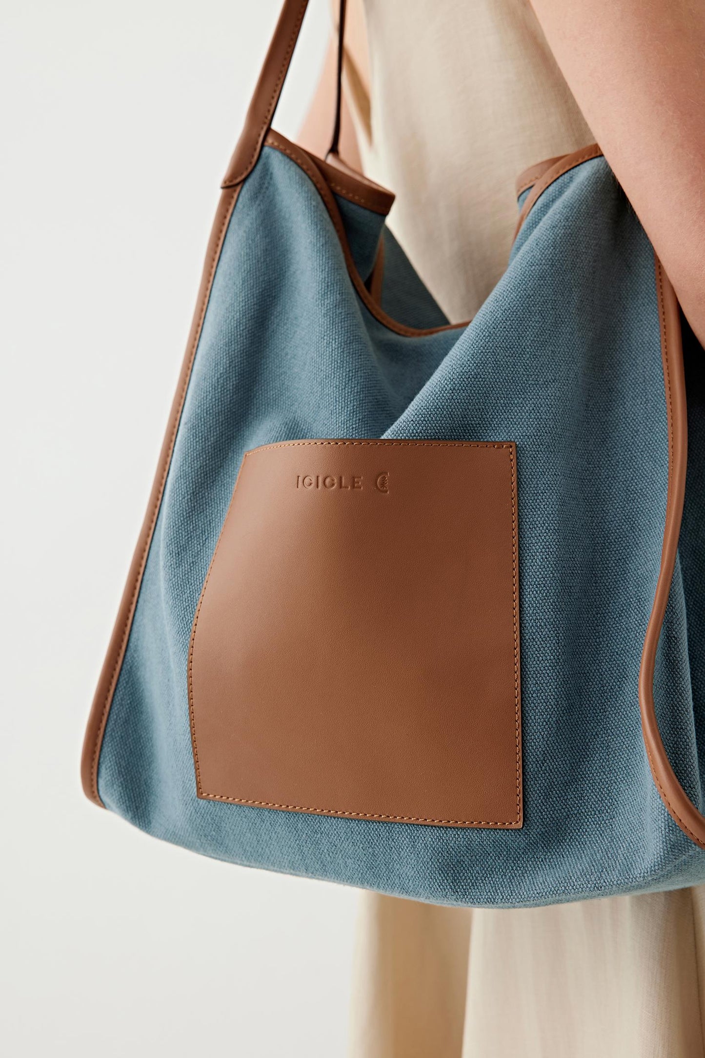 Close-up of leather panel and textile showing contrast between smooth leather and woven fabric texture