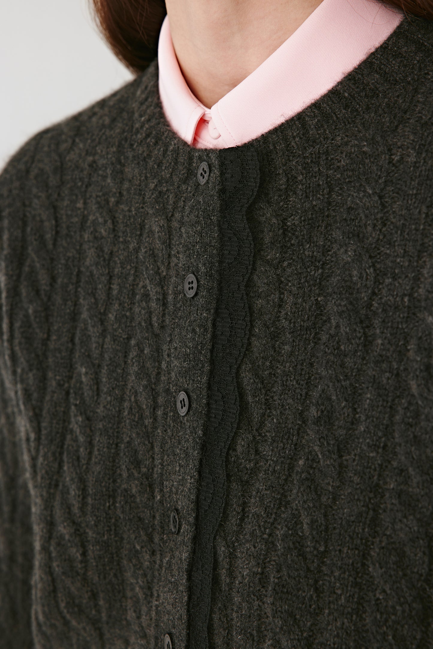 Macro view of the knit surface revealing the harmonious mix of cashmere, alpaca and silk fibres that create its delicate sheen