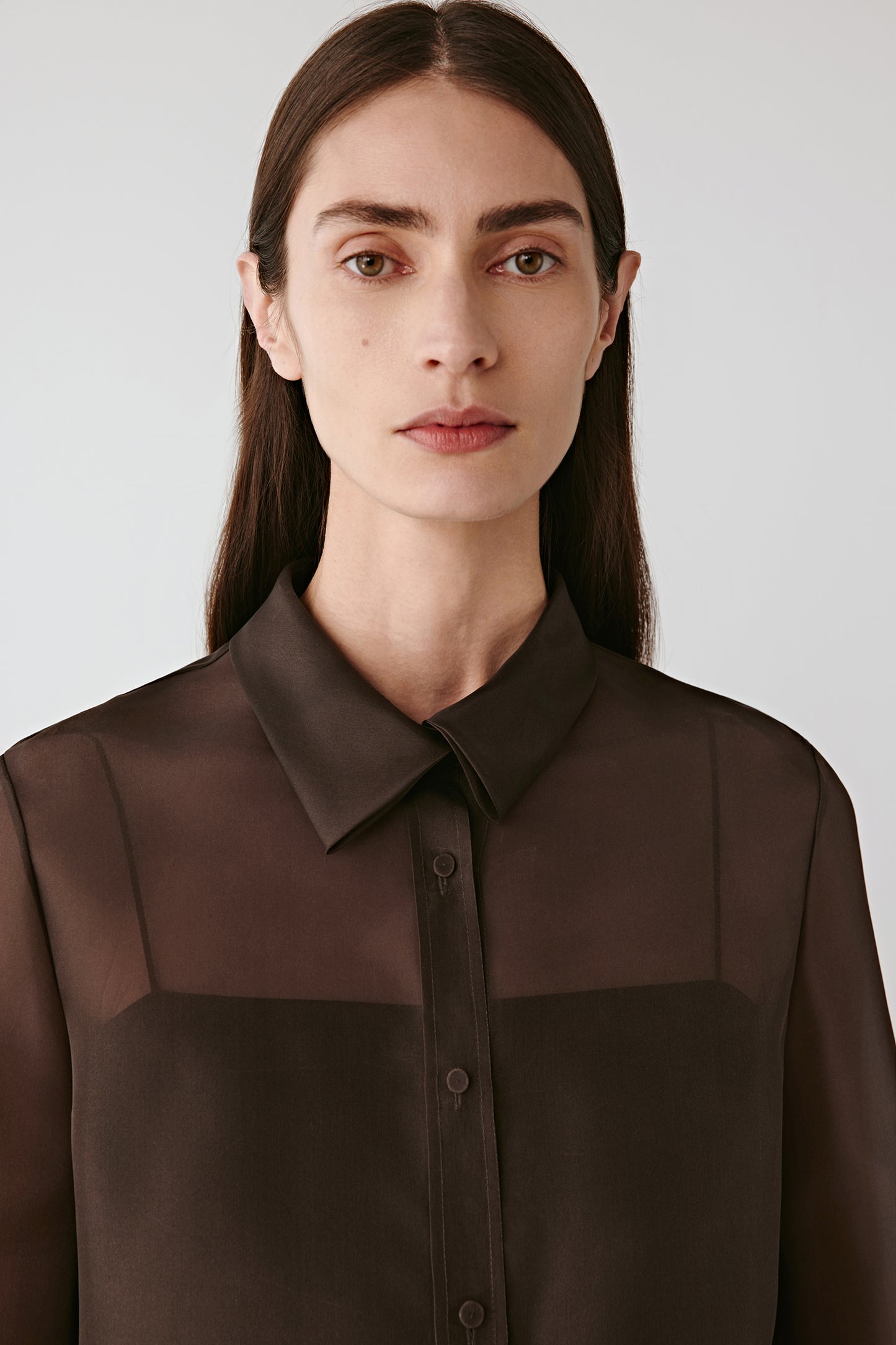 Front portrait focusing on the stand collar, tonal buttons and refined structure of the front placket.