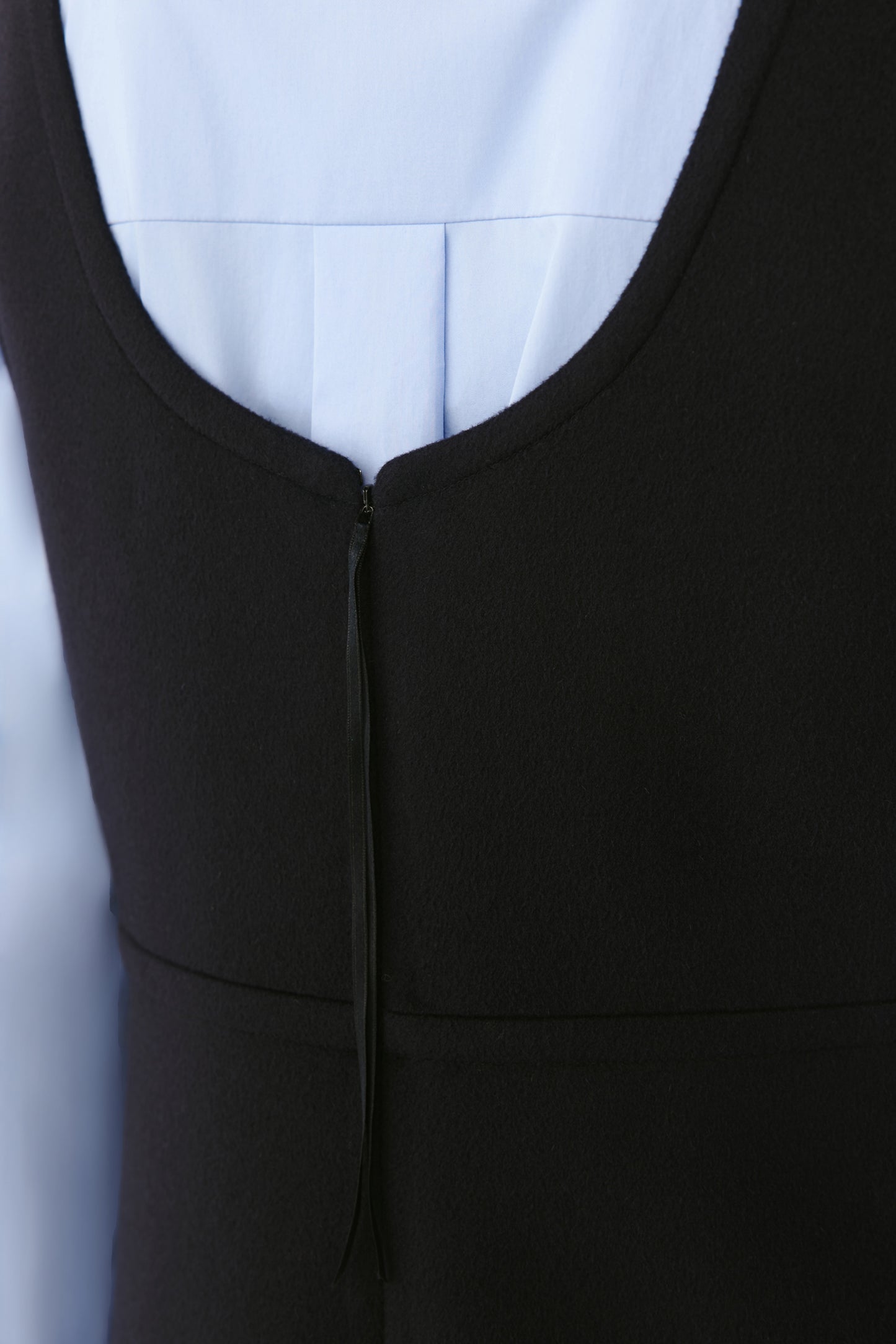 Close-up of the wool cashmere texture showing the dense yet soft material and precise stitching.