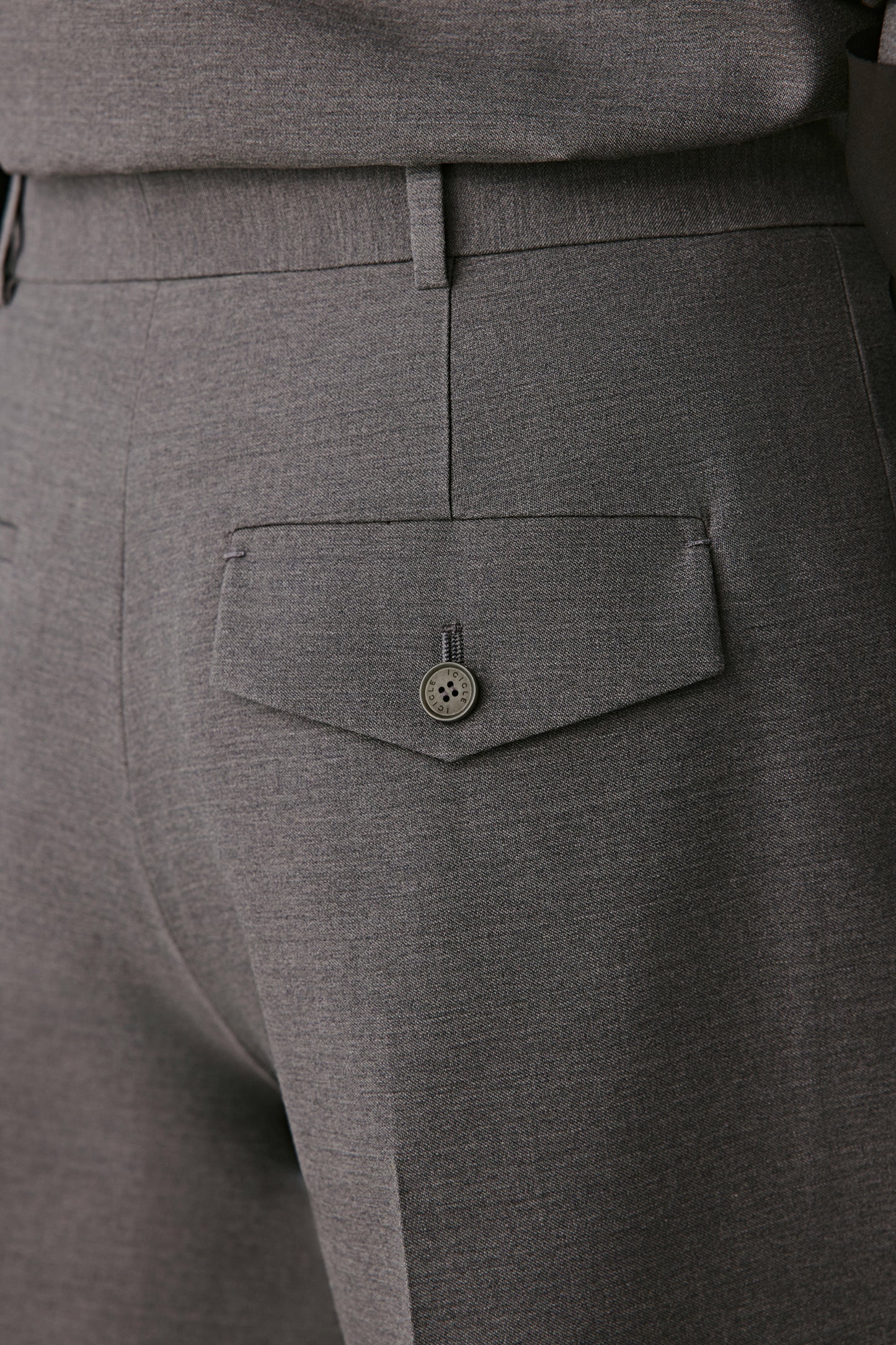 Close-up of waistband texture and satin sheen.