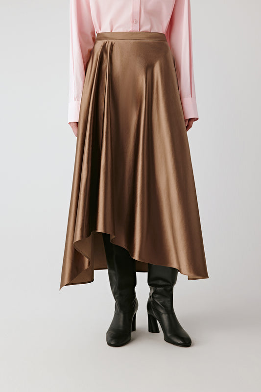 Front view showing the asymmetric hem and the luminous sheen of the satin weave.