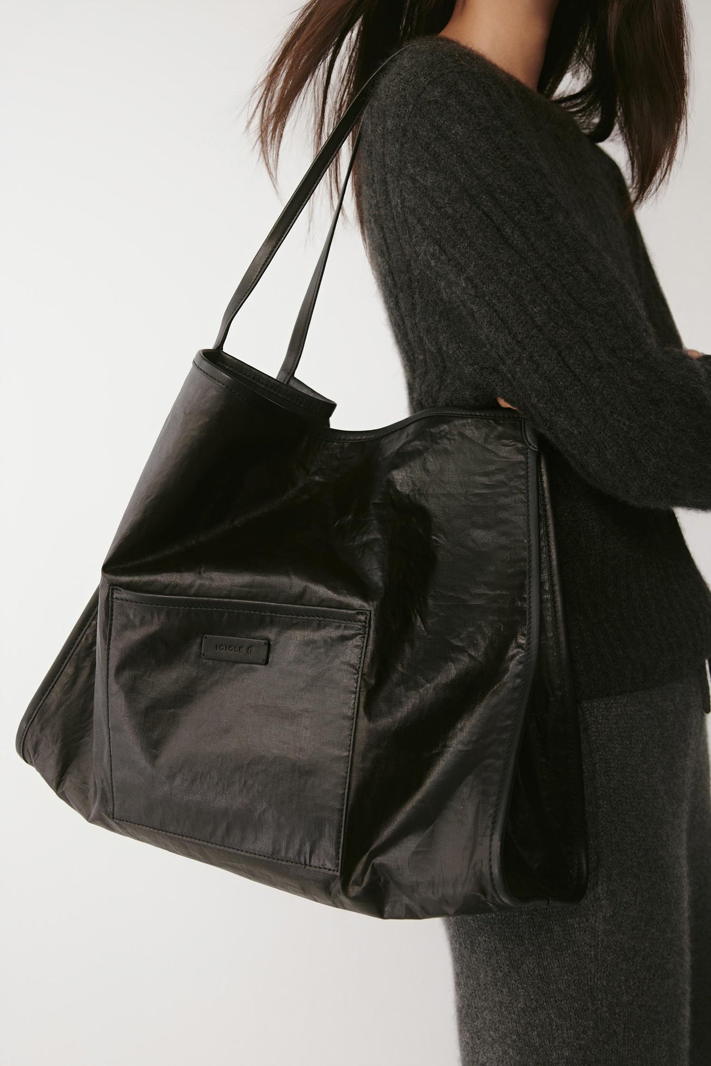Close-up of the bag’s side and strap, highlighting the soft sheen and crinkled cotton texture.