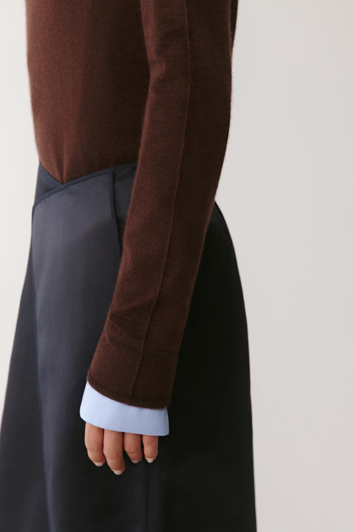 Close-up of the sleeve and hem, showing the fine ribbed edges and texture of the cashmere.