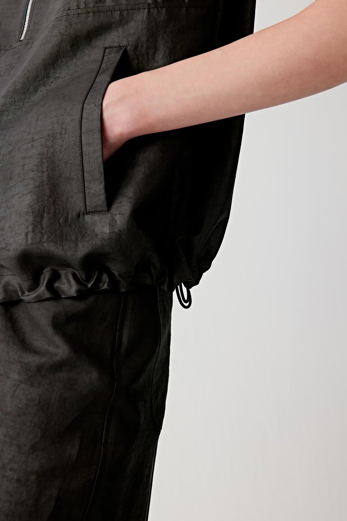 Close-up of pocket and side detail showing stitching, texture and fabric density