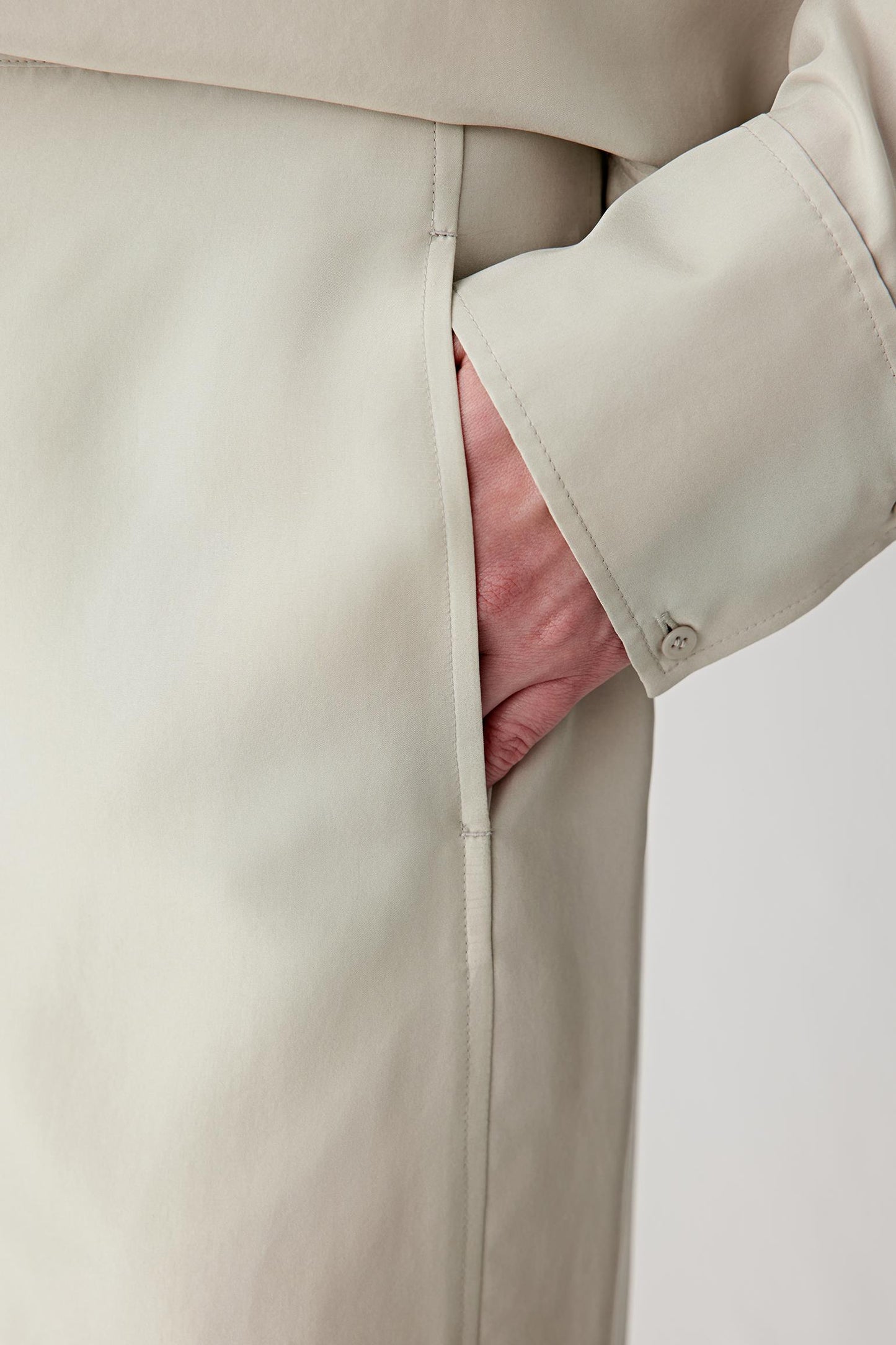 Close-up of the pocket area, highlighting the discreet pocket construction, seam lines and fine finishing details, with emphasis on the lightweight structure of the silk fabric