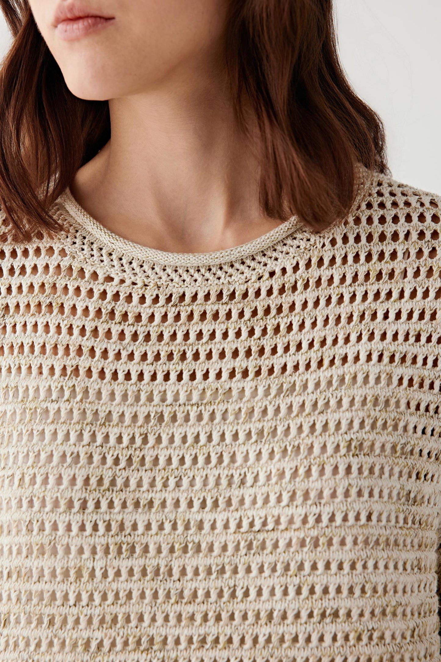 Close-up of neckline showing finishing and knit density variation