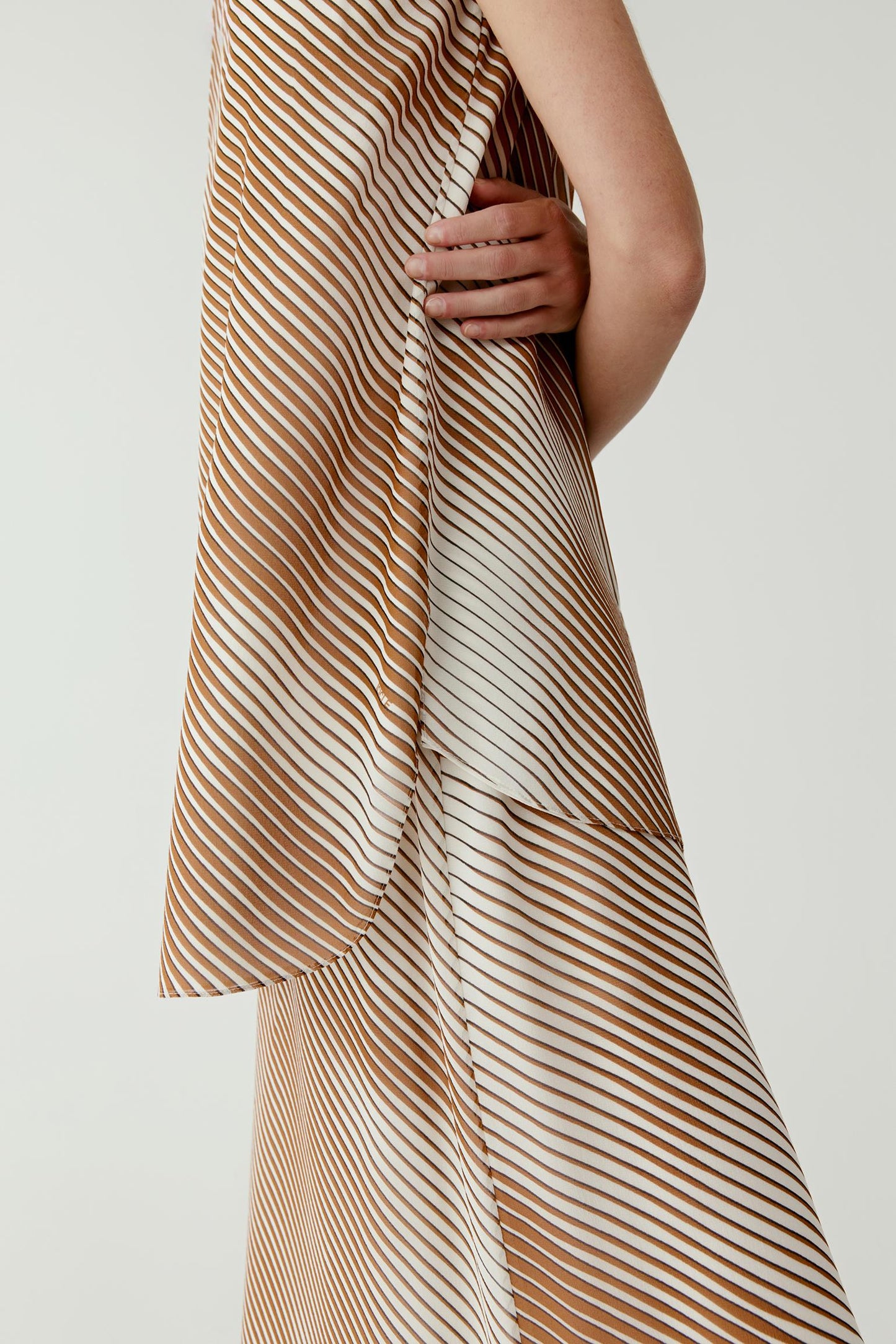 Close-up of the fabric showing the fine silk texture, soft sheen and detailed pattern with a light, airy structure