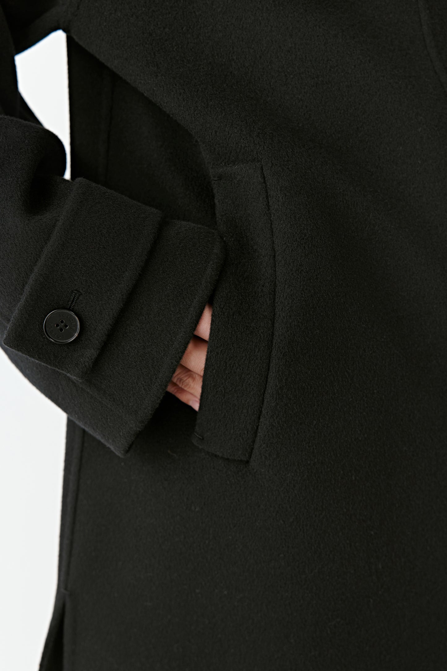 Detail of the sleeve and button showing the fine tailoring.