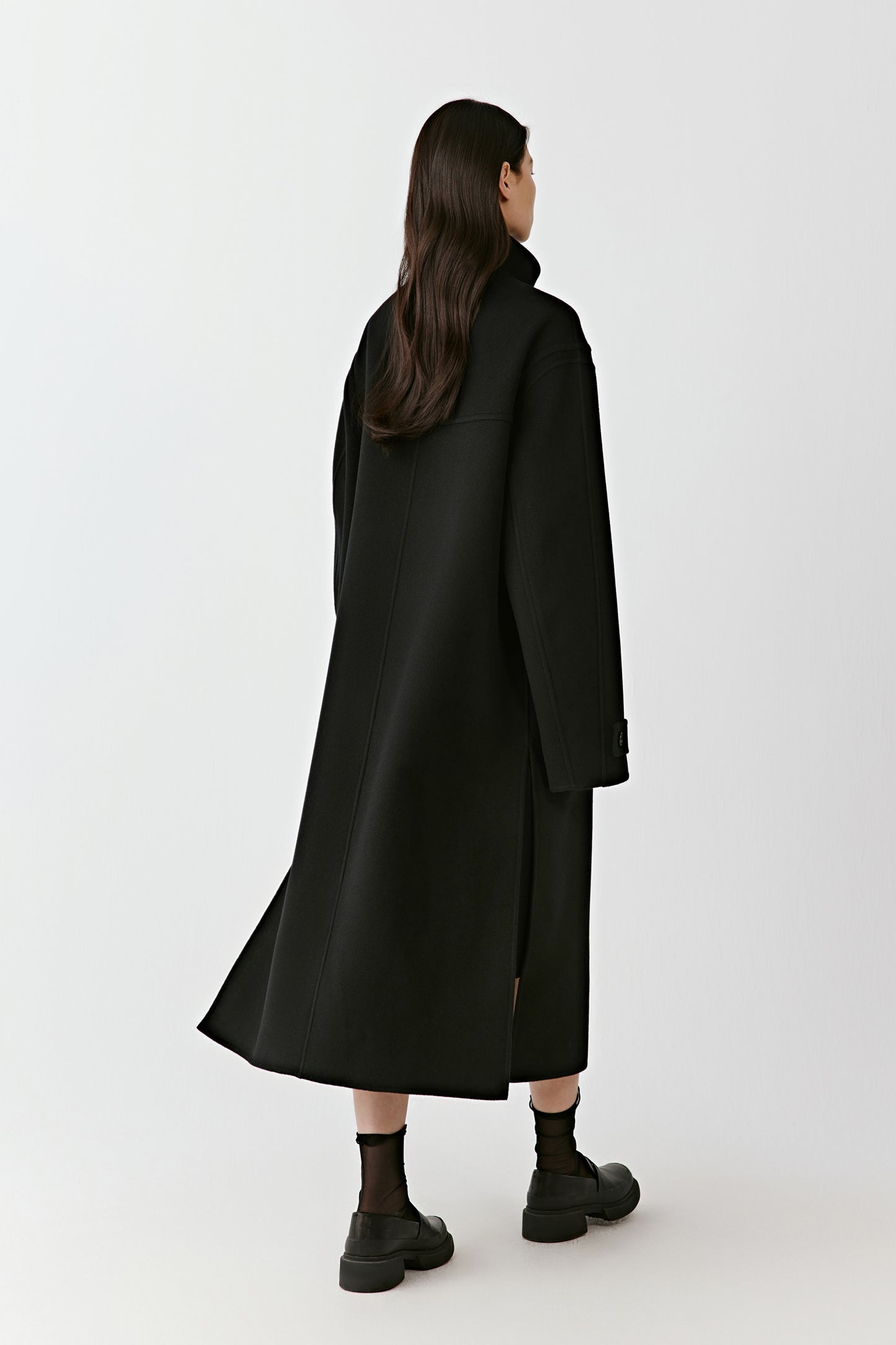 Rear view showing the elongated silhouette and fluid movement.