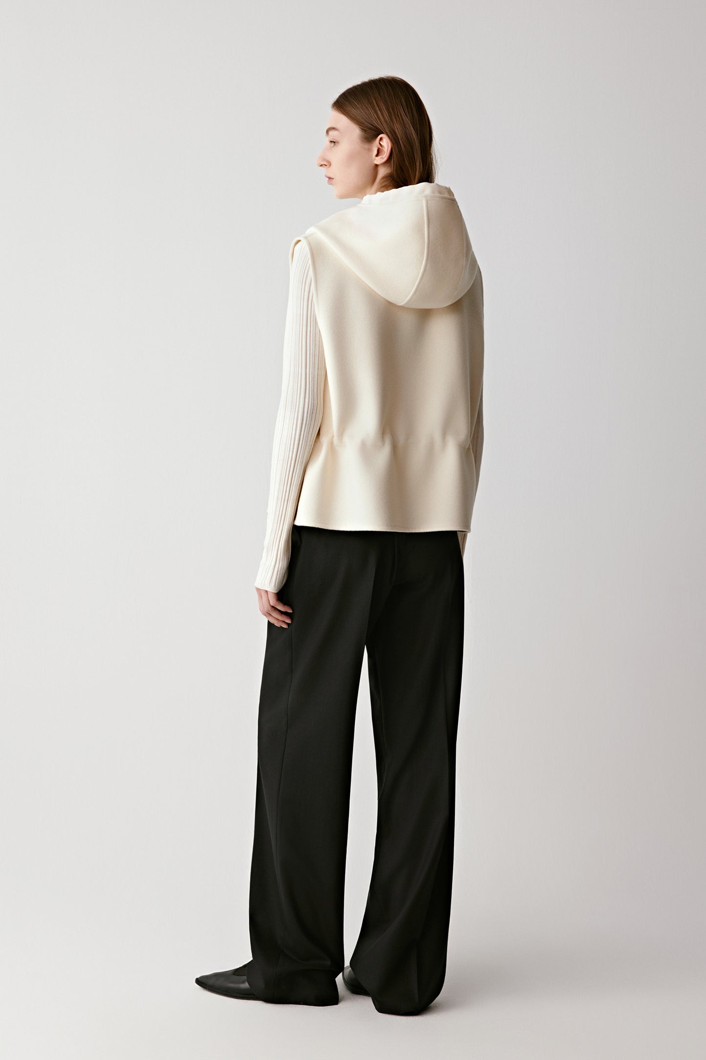 Three-quarter view highlighting the balance of soft volume and clean lines.