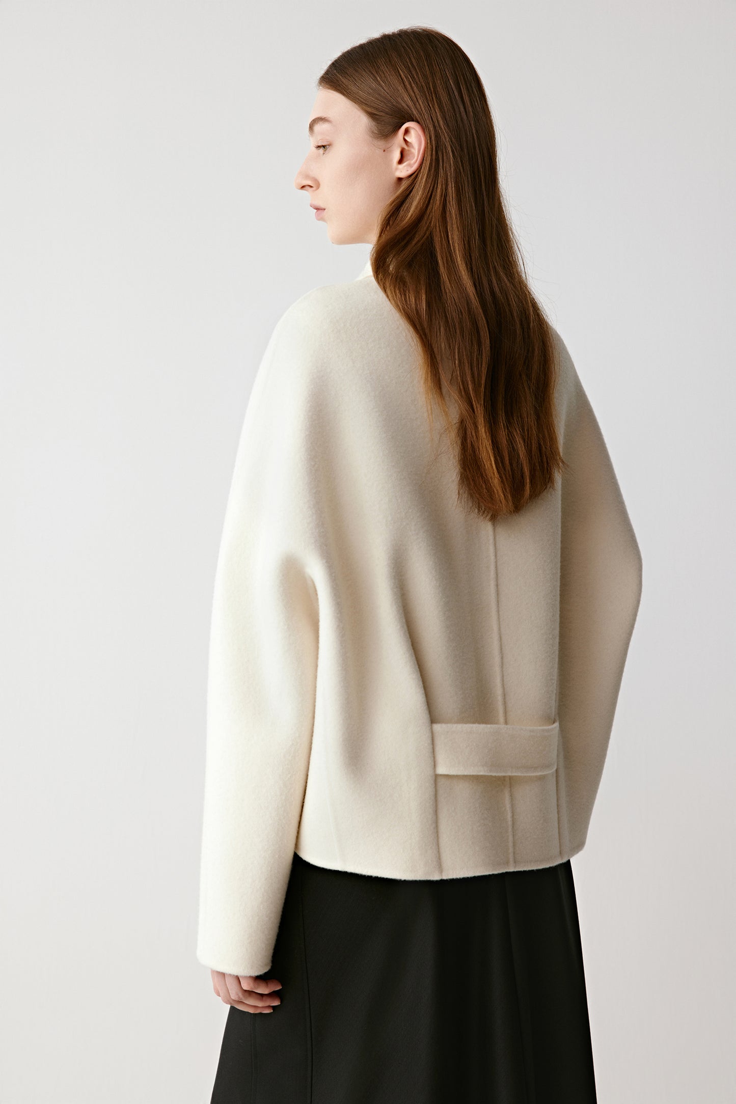 Rear view emphasizing the clean lines and relaxed flow.