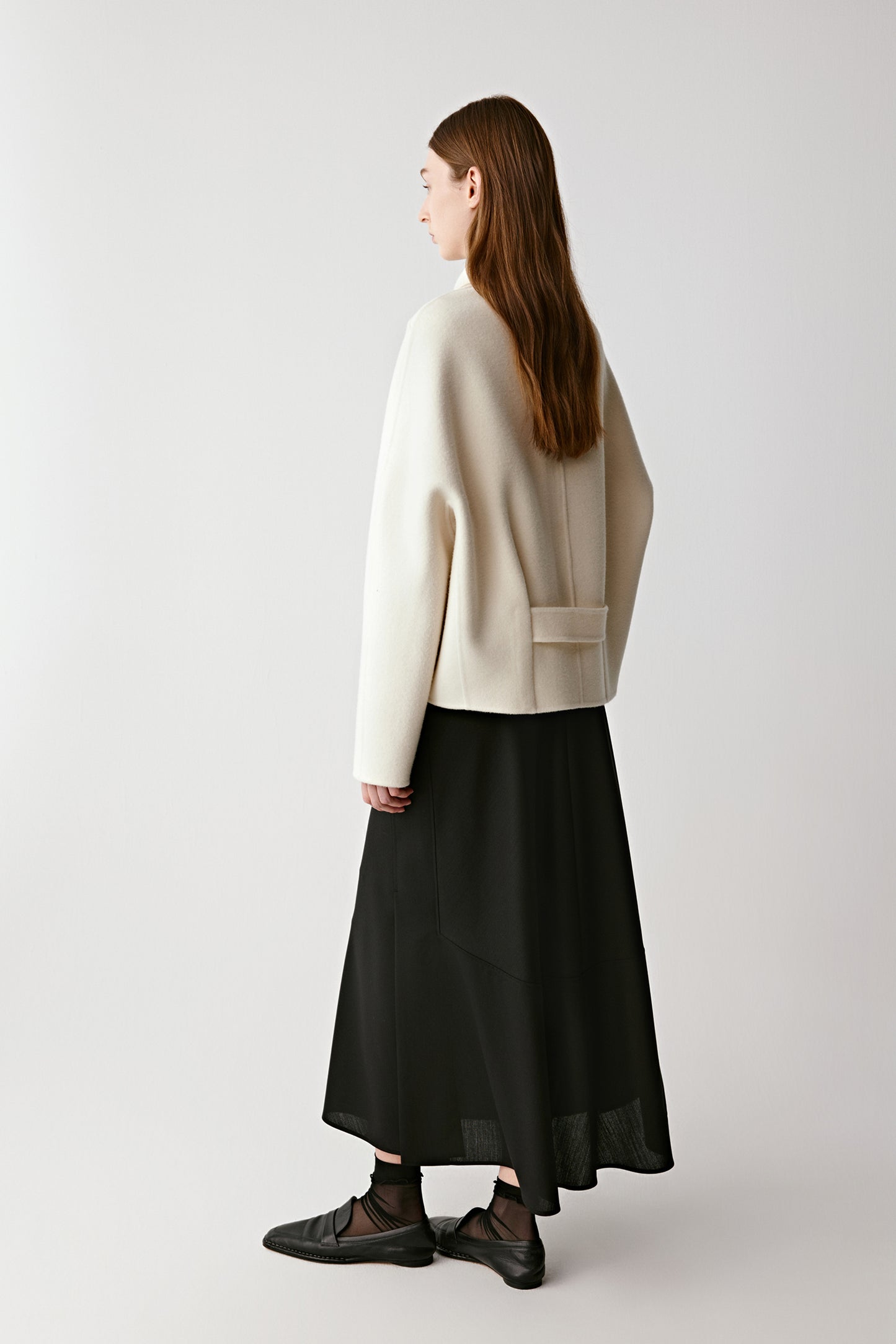 Three-quarter view highlighting the double-faced structure and soft movement.