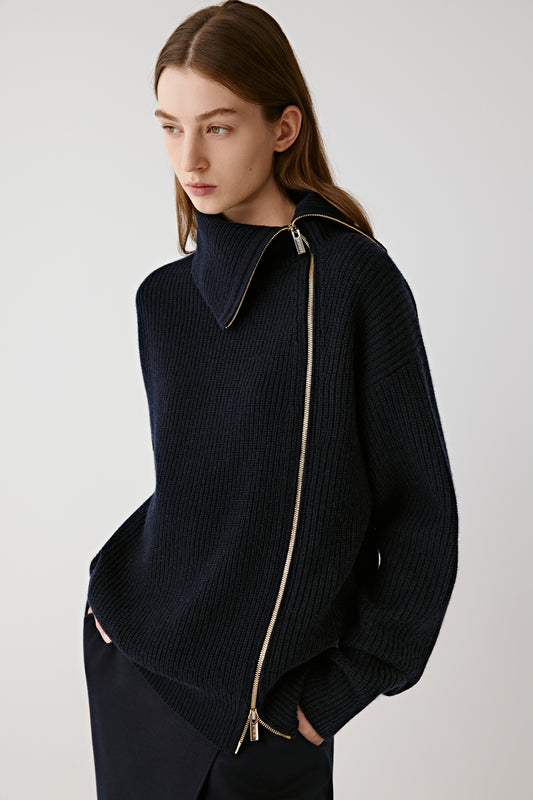 Three-quarter side view showing the stand collar and draped asymmetric silhouette.