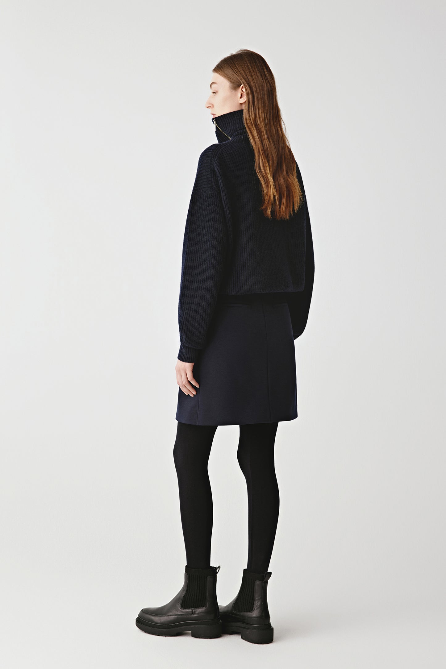 Full-length view highlighting the longline fit and clean hemline of the cardigan.