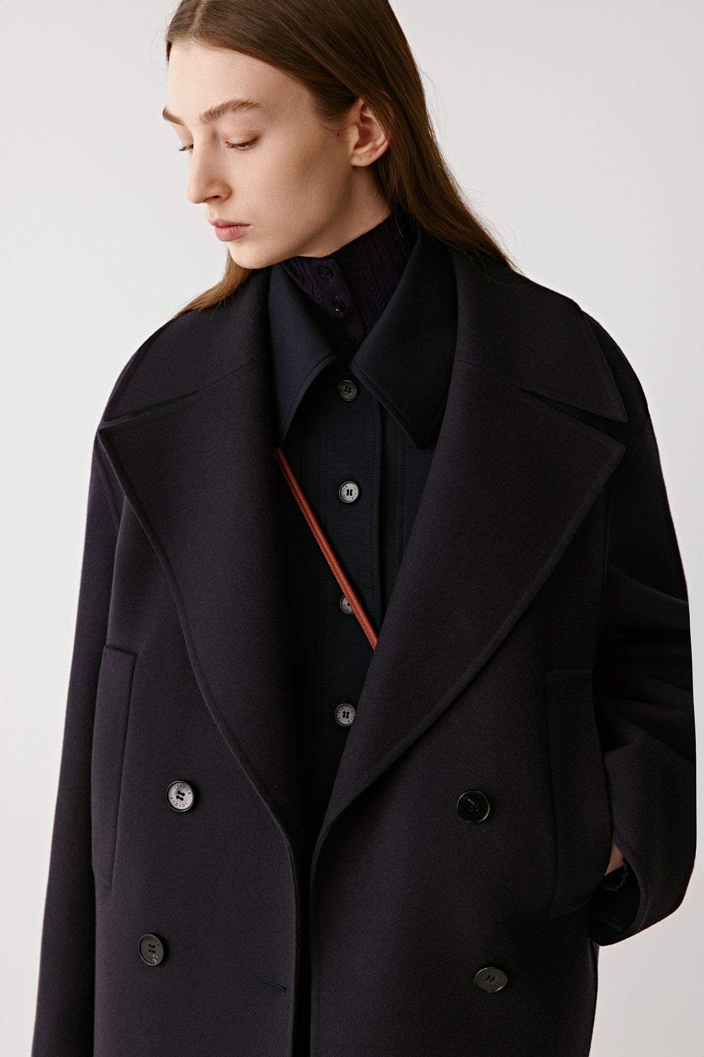 Side view close-up showing the soft texture of the double-faced wool and cashmere fabric.