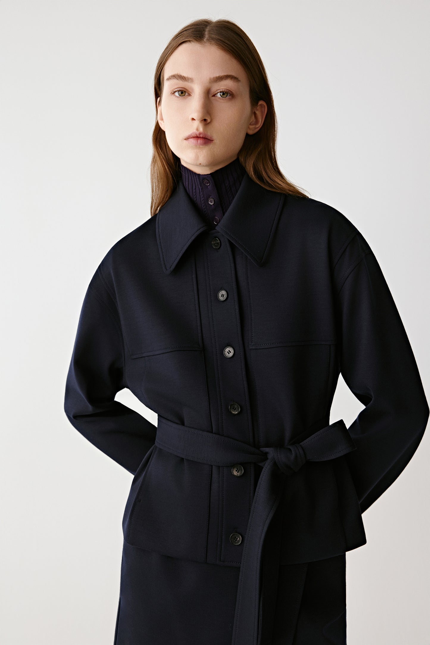 Front side view showing the short cut and the soft structure of the worsted wool fabric.