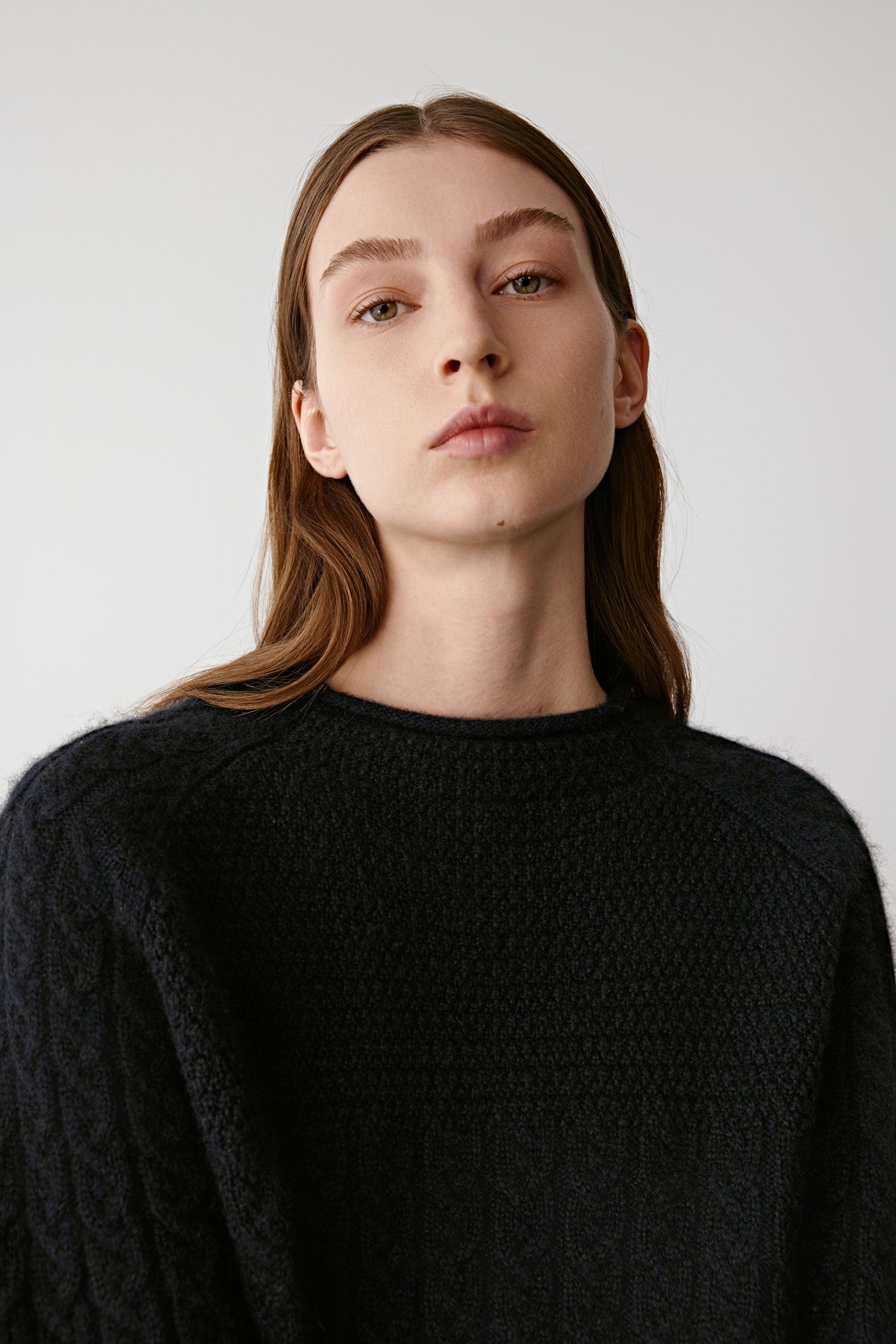 Three-quarter view emphasizing the textured pattern and ribbed neckline.