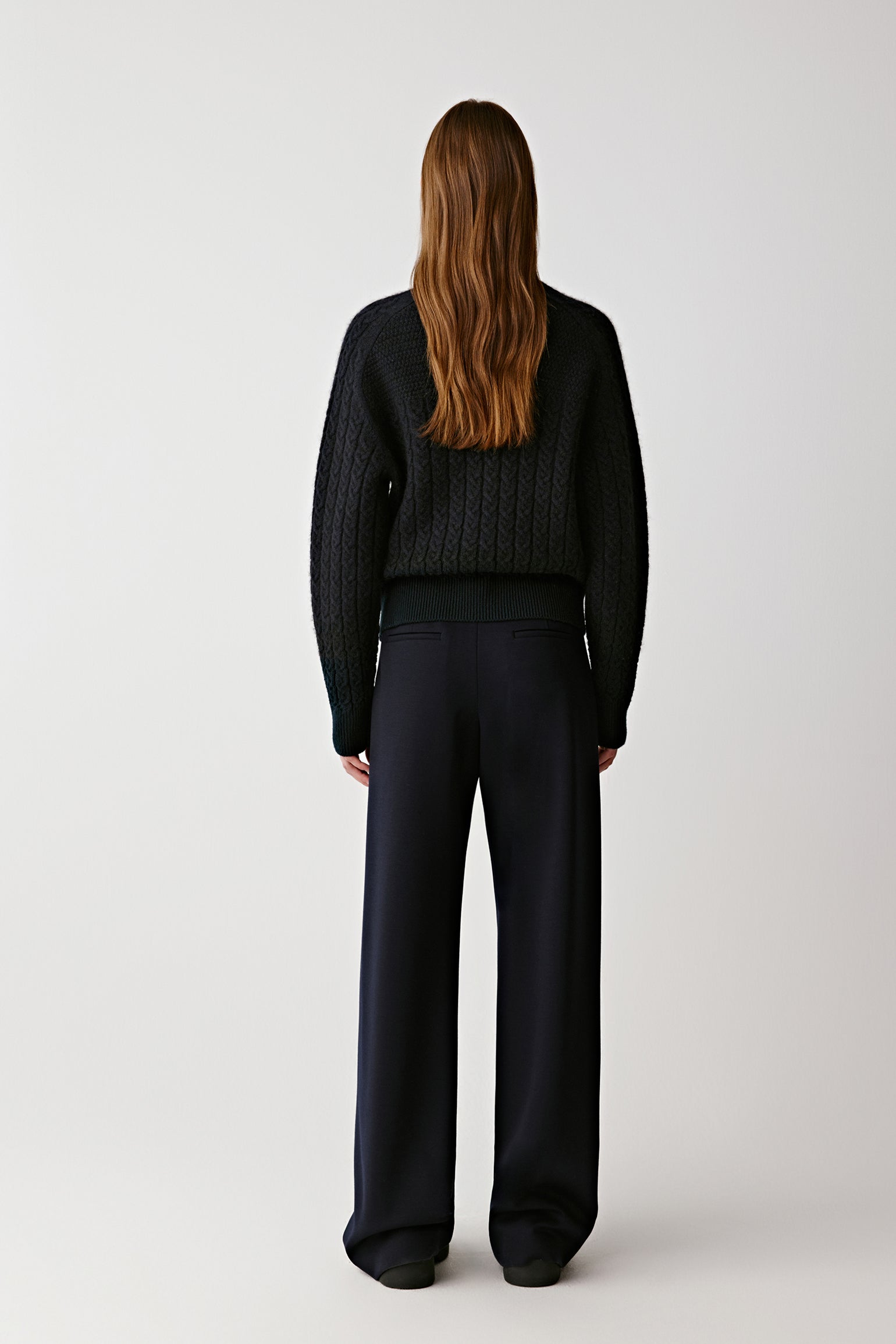 Full-length view showing the relaxed silhouette and natural drape of the jumper.